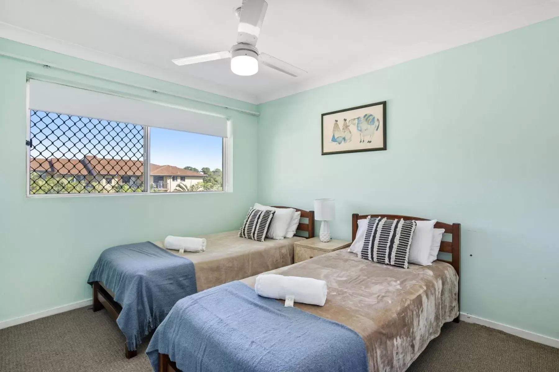 Bed in Kirra Palms Holiday Apartments