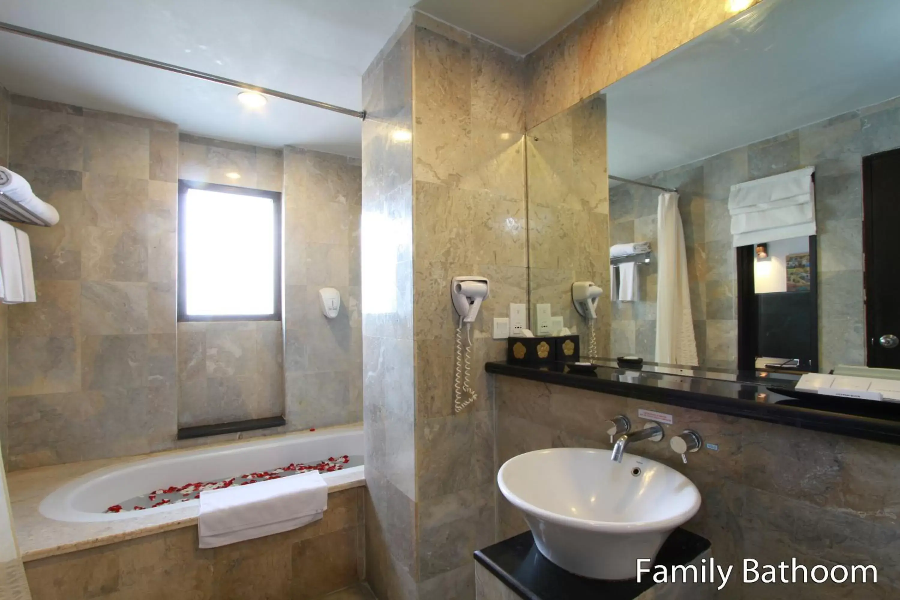 Bathroom in The Lokha Legian Resort & Spa