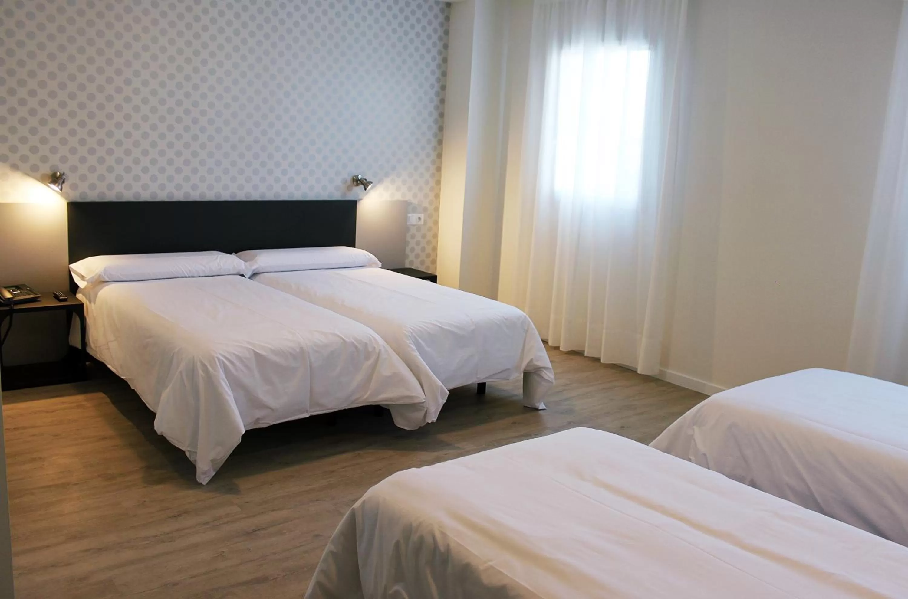 Photo of the whole room, Bed in Checkin Urban Nevada