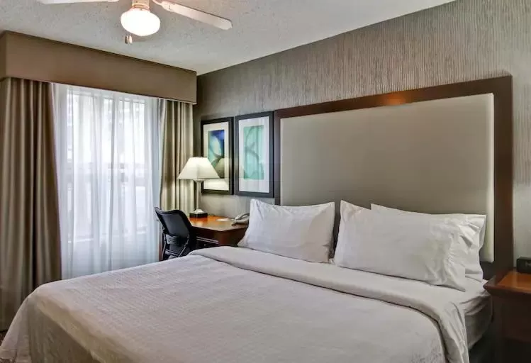 Bed in Poplar Inn and Suites