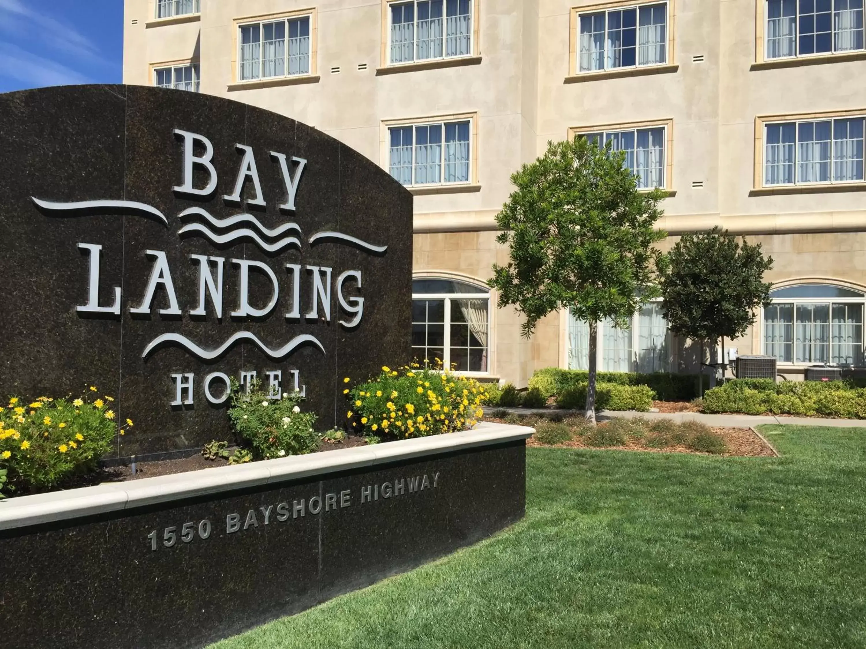 Property logo or sign in Bay Landing Hotel