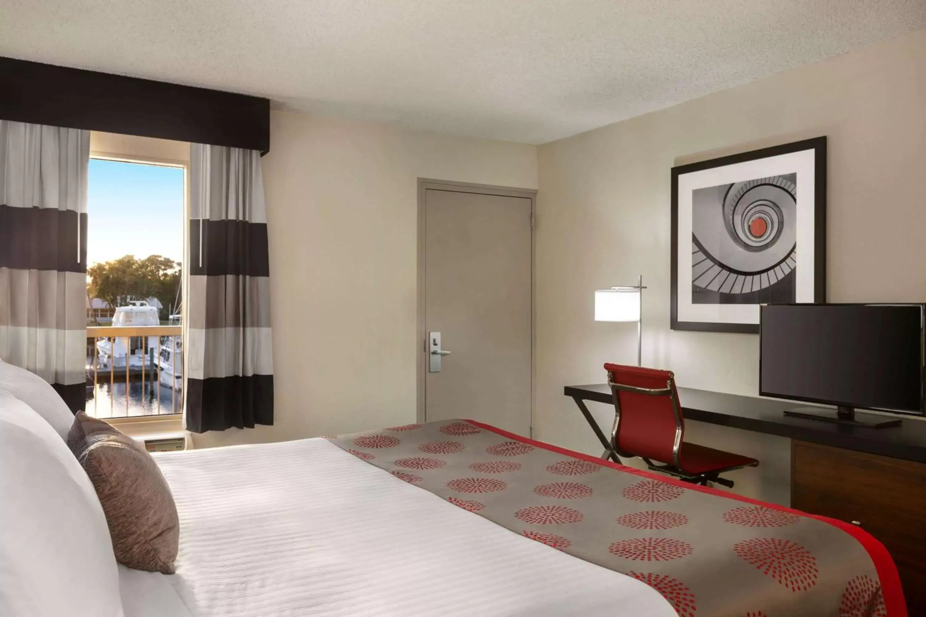 Photo of the whole room, Bed in Ramada by Wyndham Sarasota Waterfront