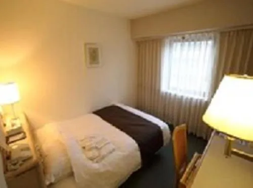 Photo of the whole room, Bed in Nest Hotel Matsuyama