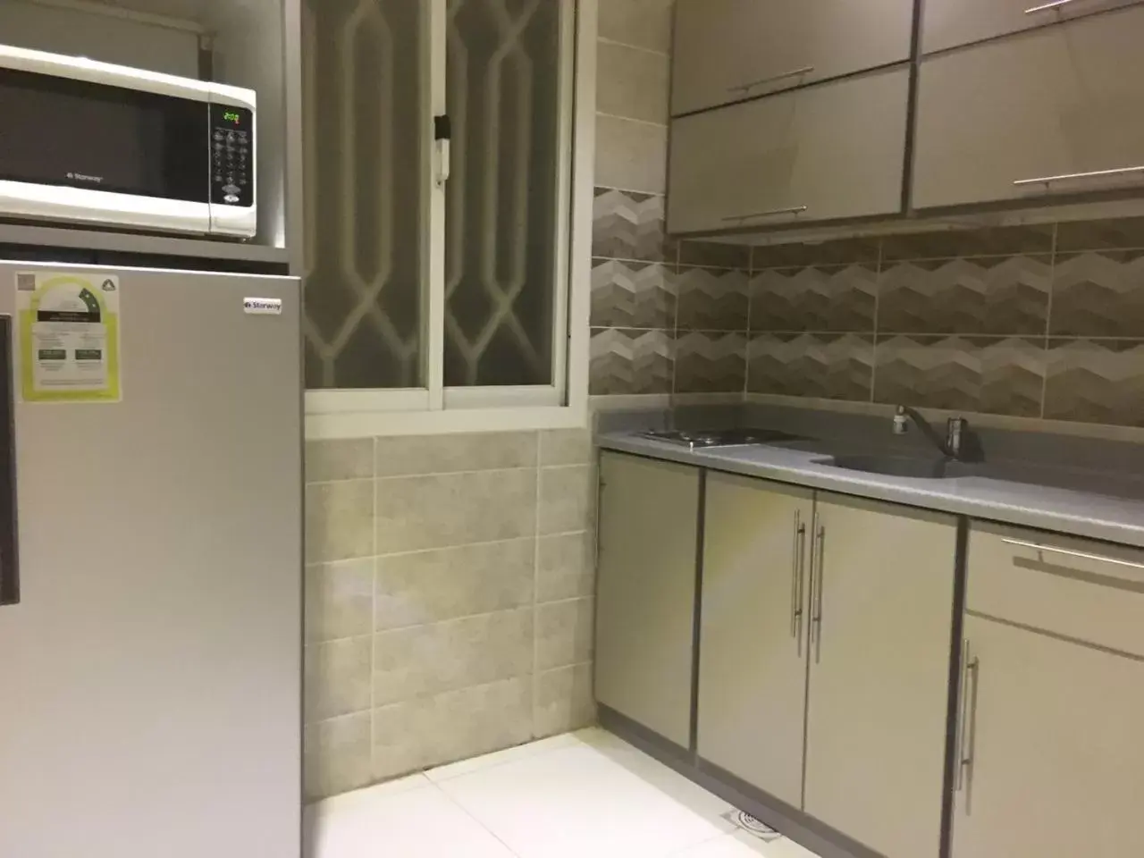 Kitchen/Kitchenette in Taleen Al Nakheel Apartment