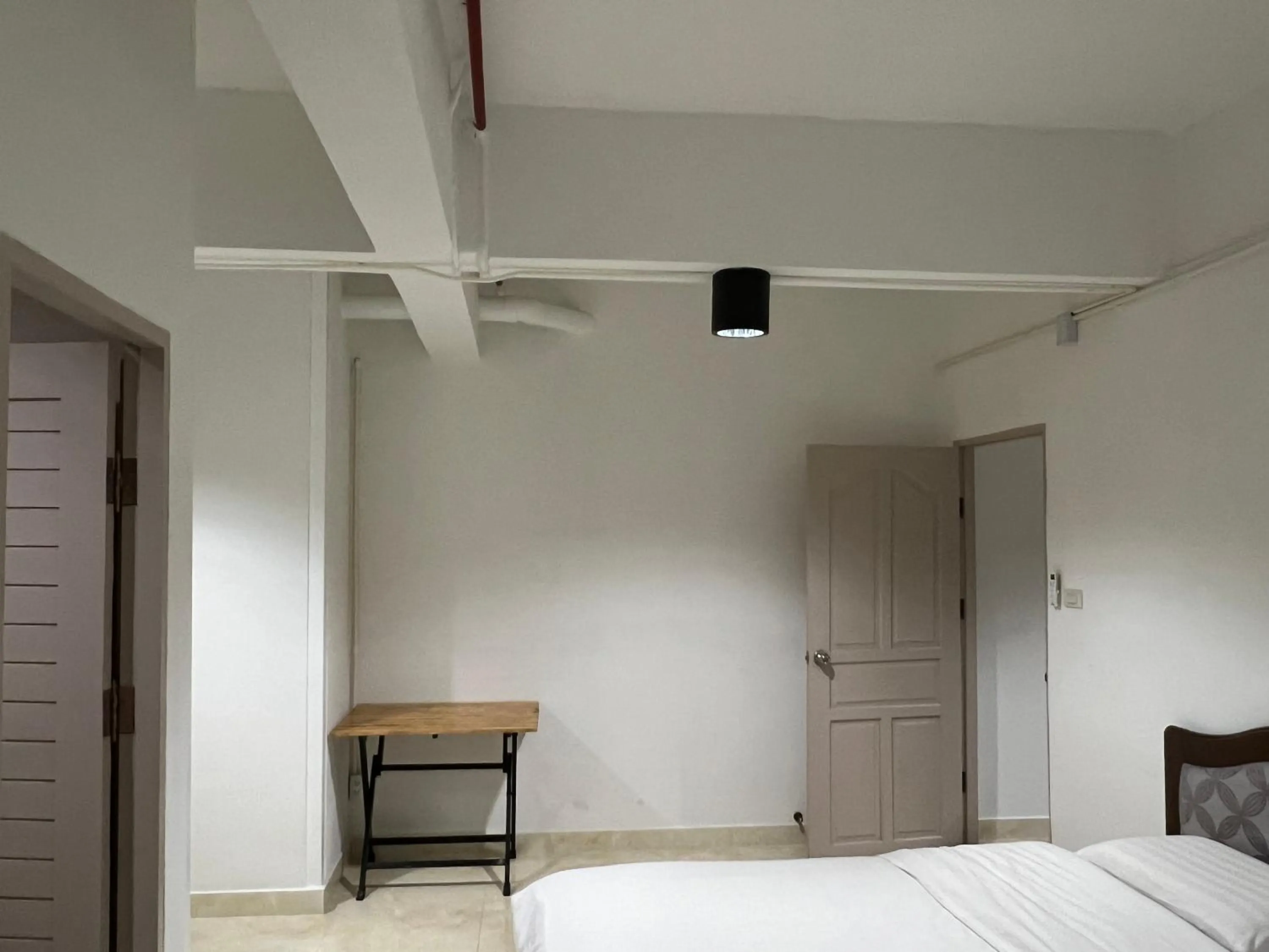 Bed in Mall Suites Hotel