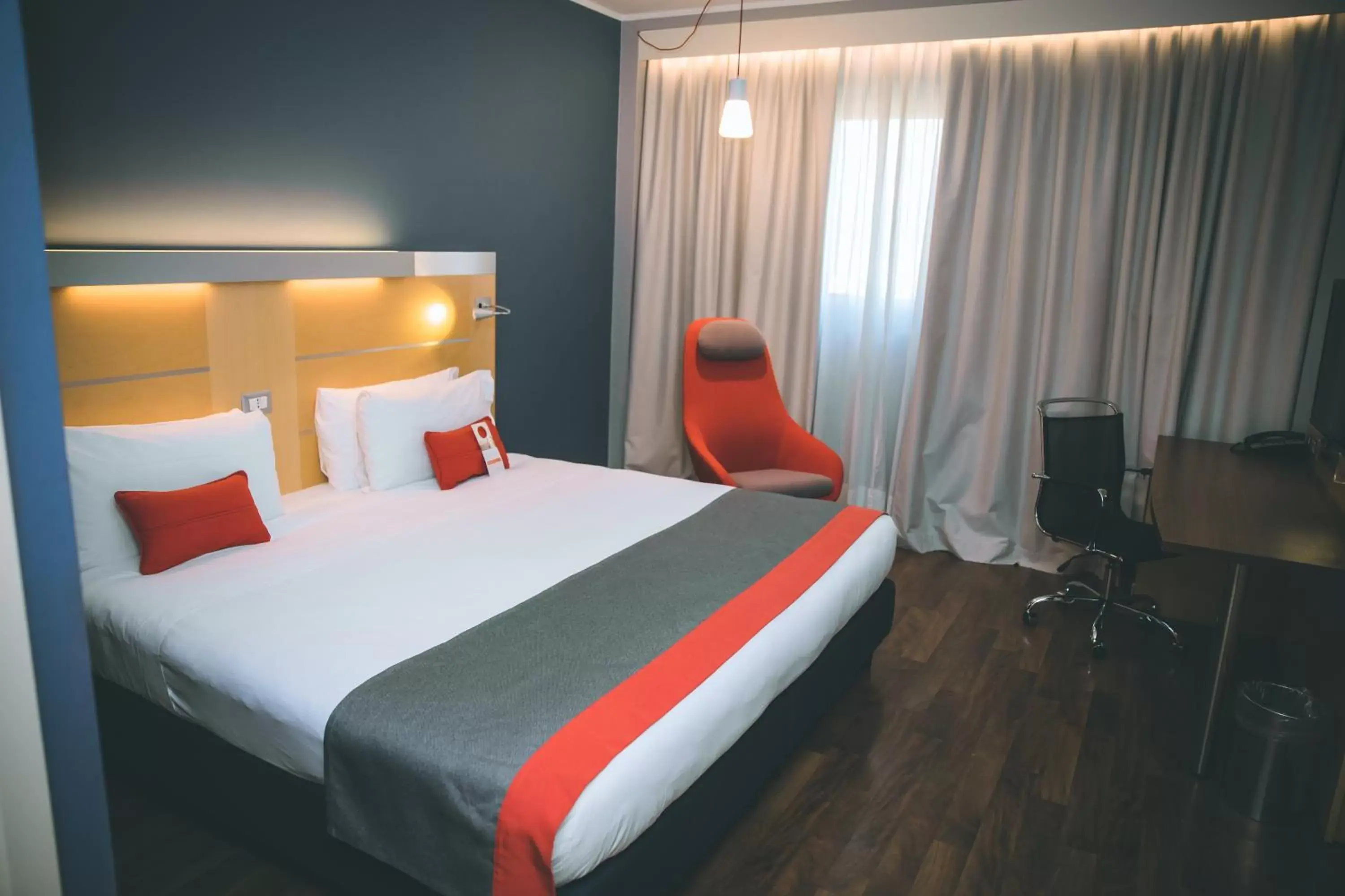 Bed in Holiday Inn Express Milan-Malpensa Airport, an IHG Hotel