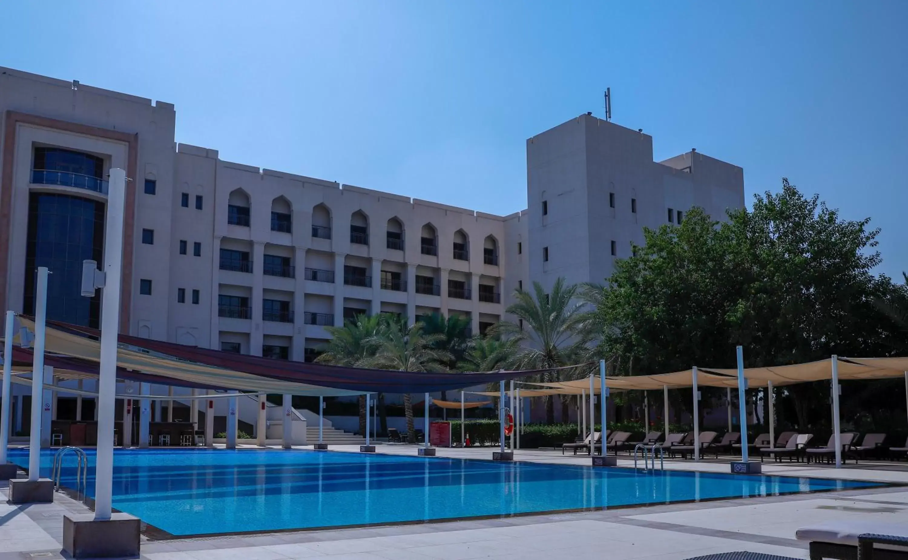 Swimming pool, Property Building in Crowne Plaza Sohar, an IHG Hotel