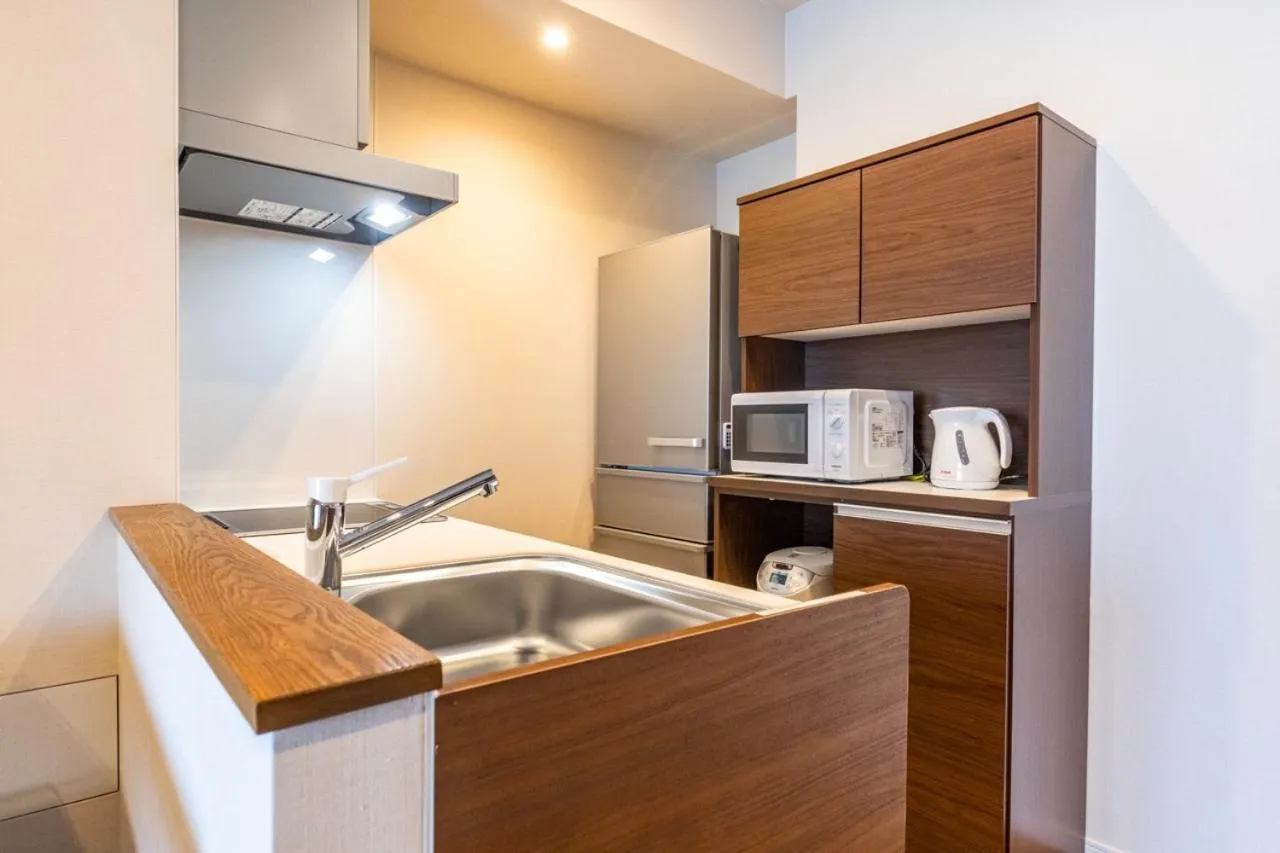 Kitchen or kitchenette in LAPIN MIHAMA Residence Hotel