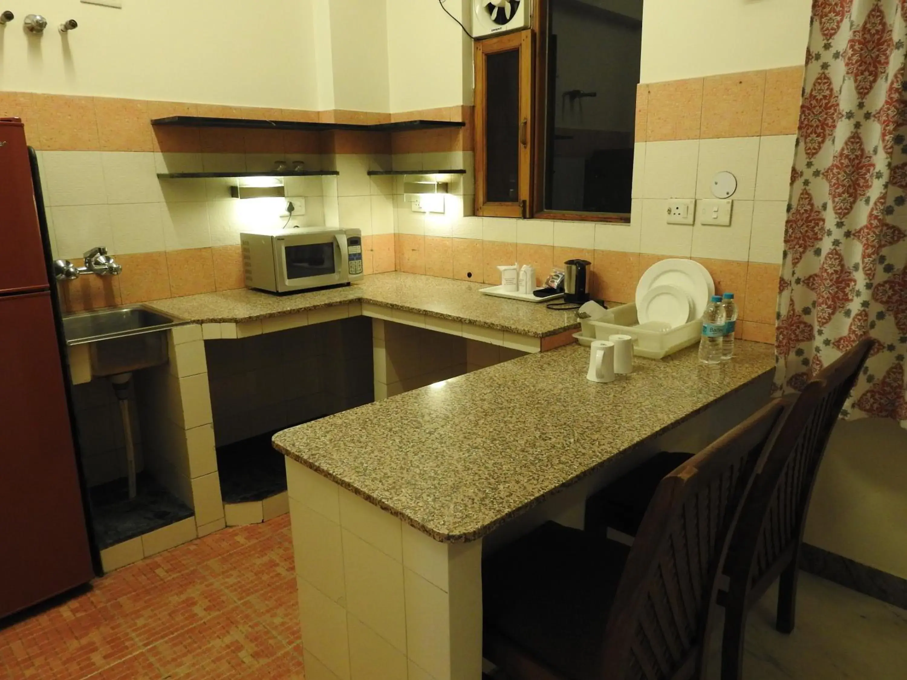 Kitchen or kitchenette, Kitchen/Kitchenette in Om Niwas Suite Hotel