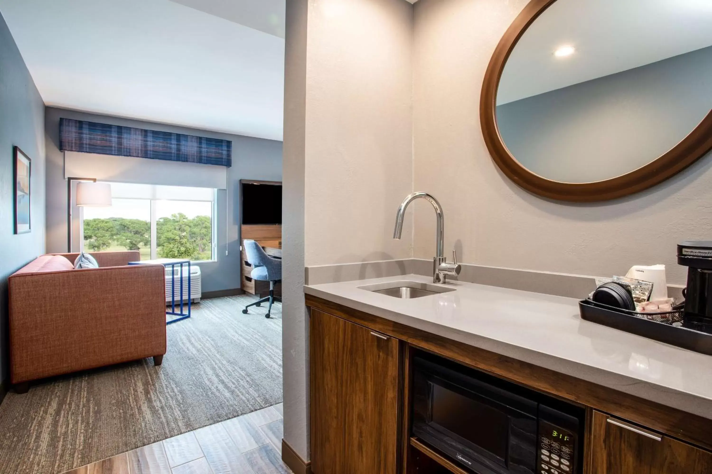 Living room, Bathroom in Hampton Inn & Suites North Port, Fl