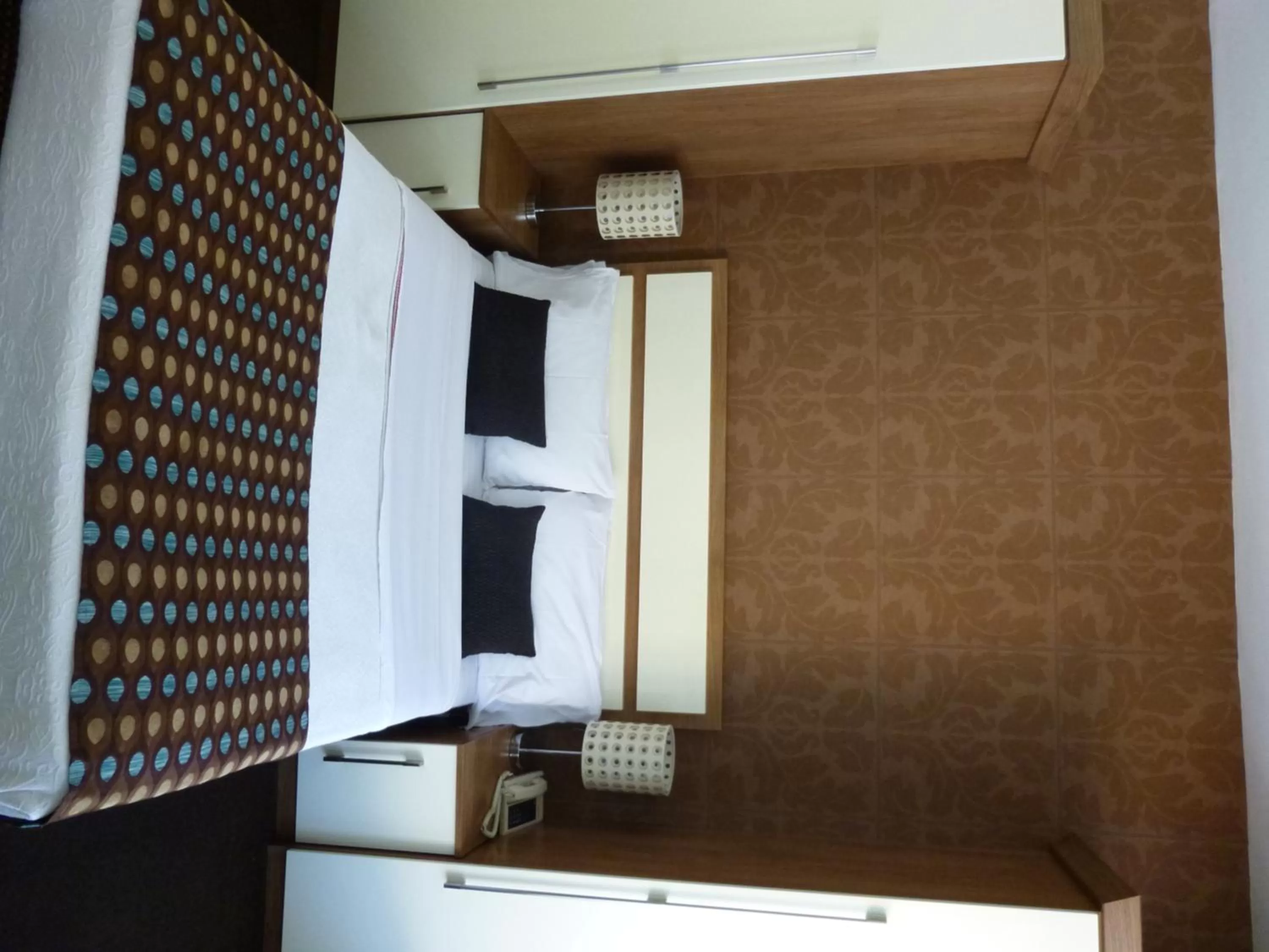 Bed in The White Lady Hotel