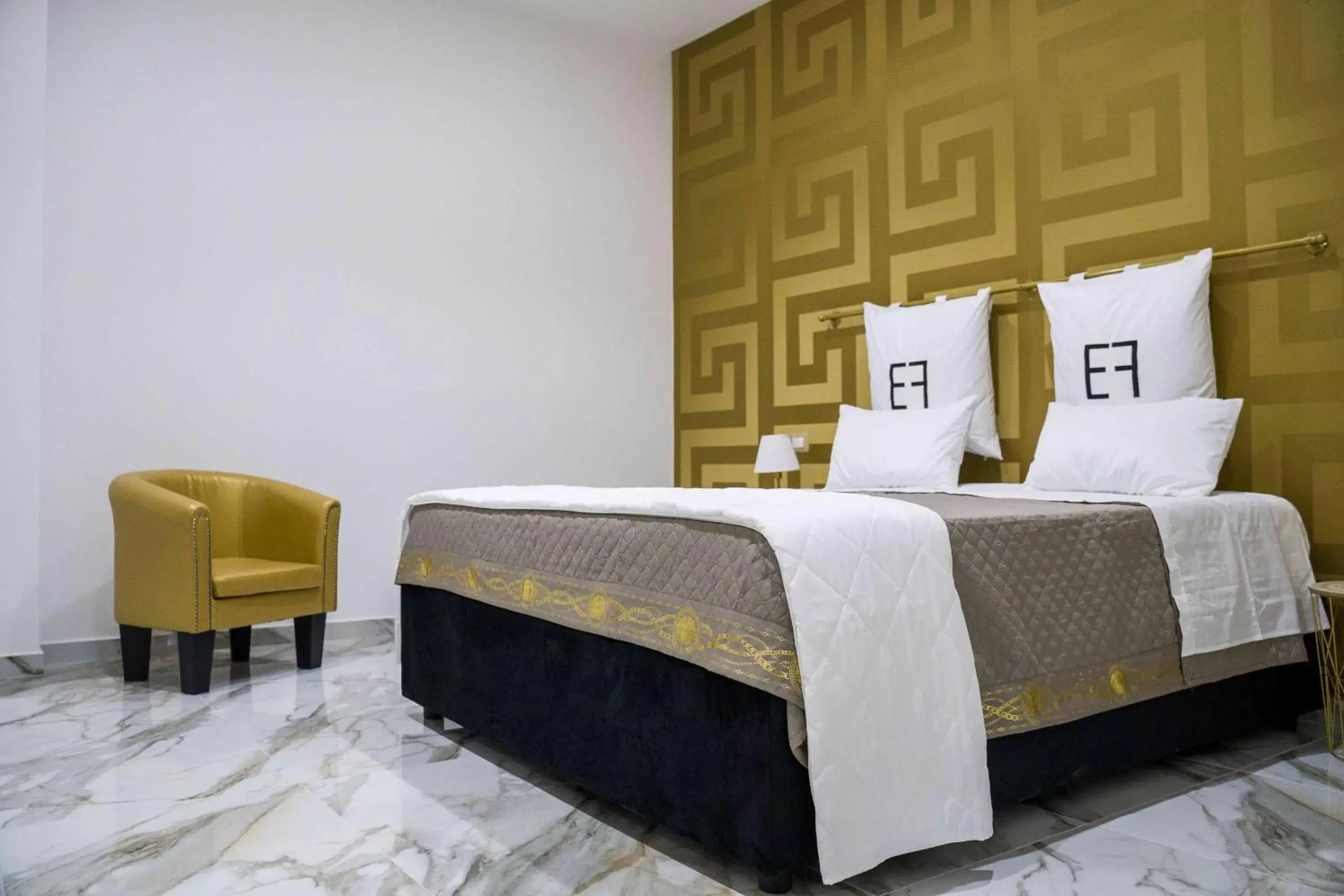 Bed in EF LUXURY LIVING RESORT AND SPA