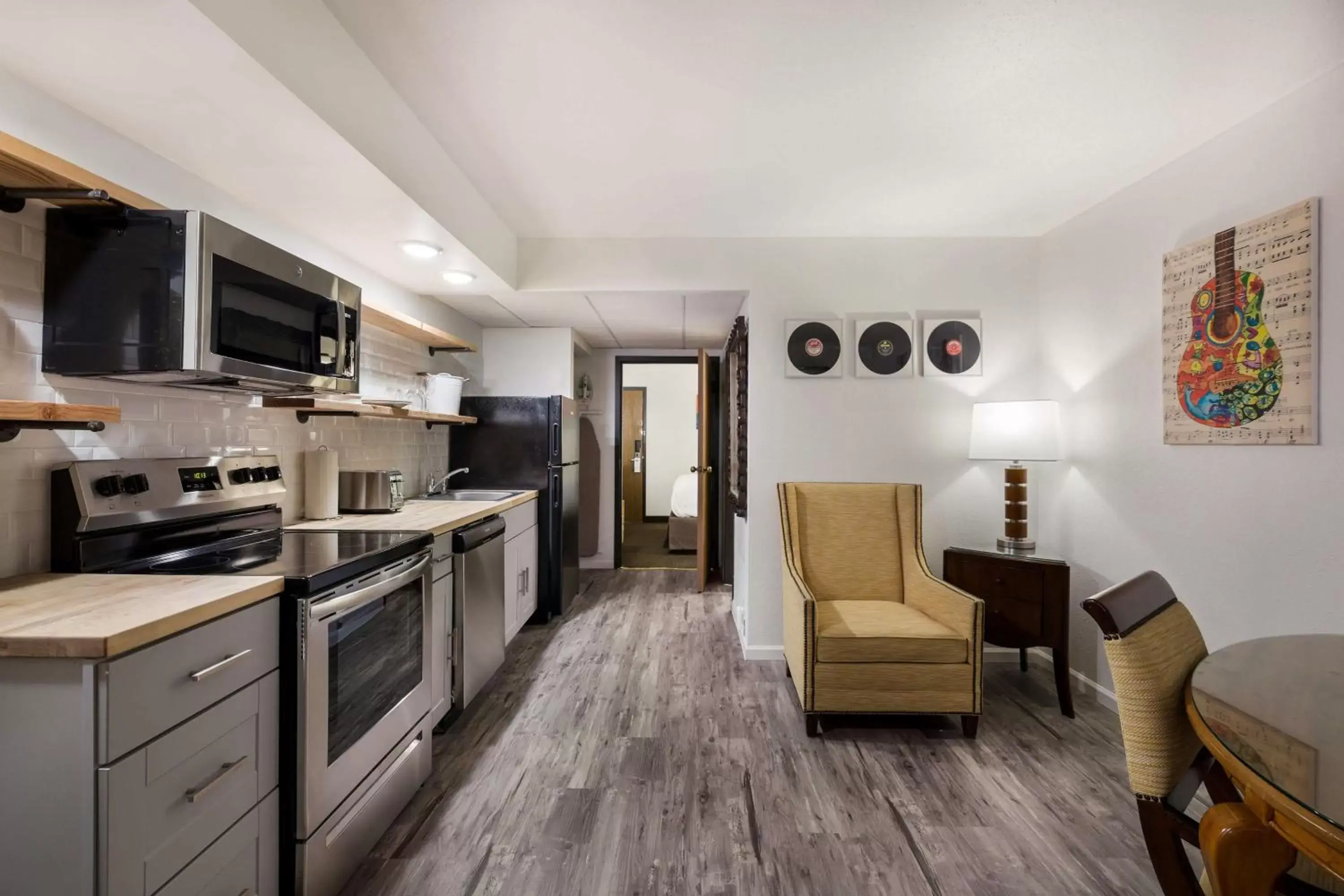 Bedroom, Kitchen/Kitchenette in Revel Hotel Minot - SureStay Collection by Best Western