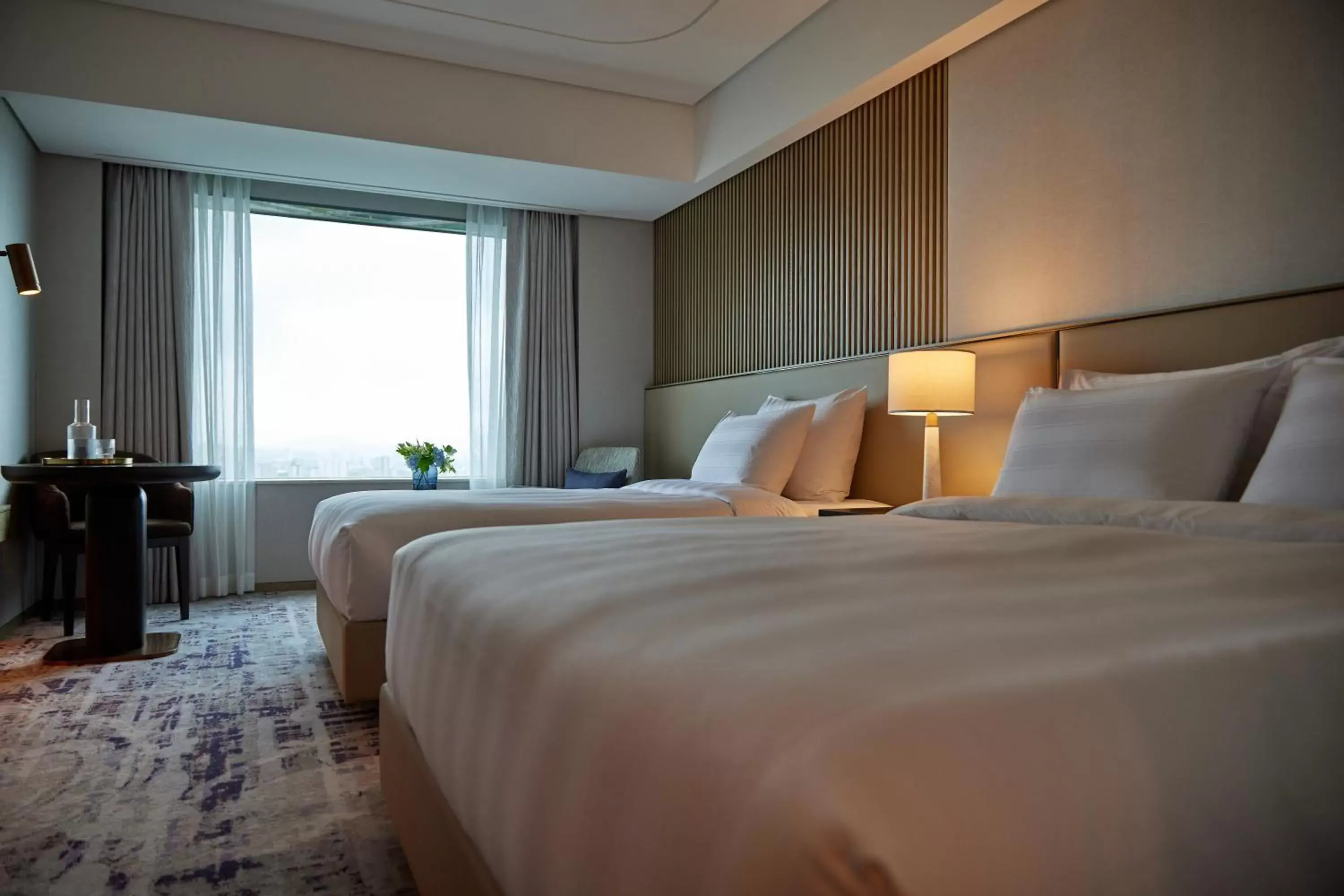 Bed in Lotte Hotel World