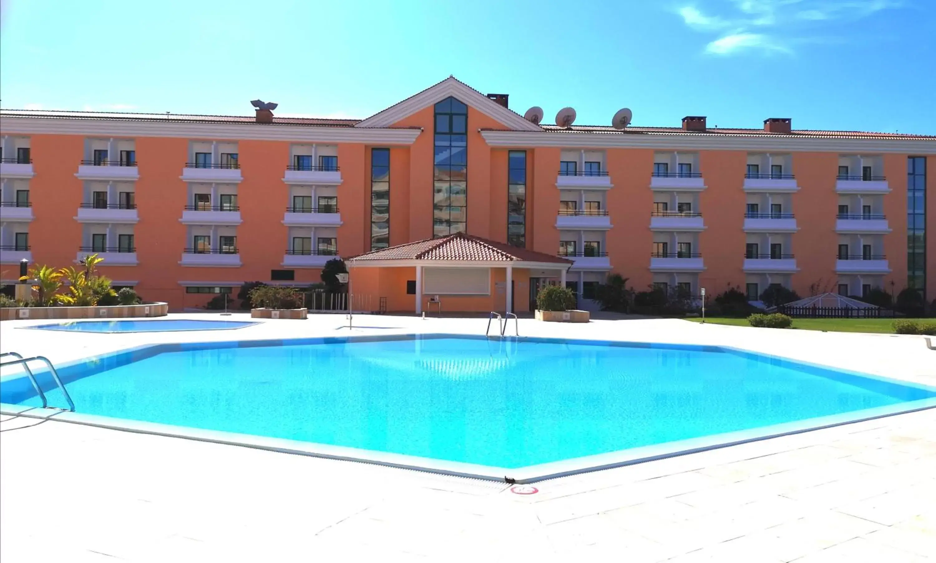 Swimming pool, Property Building in Riviera Hotel