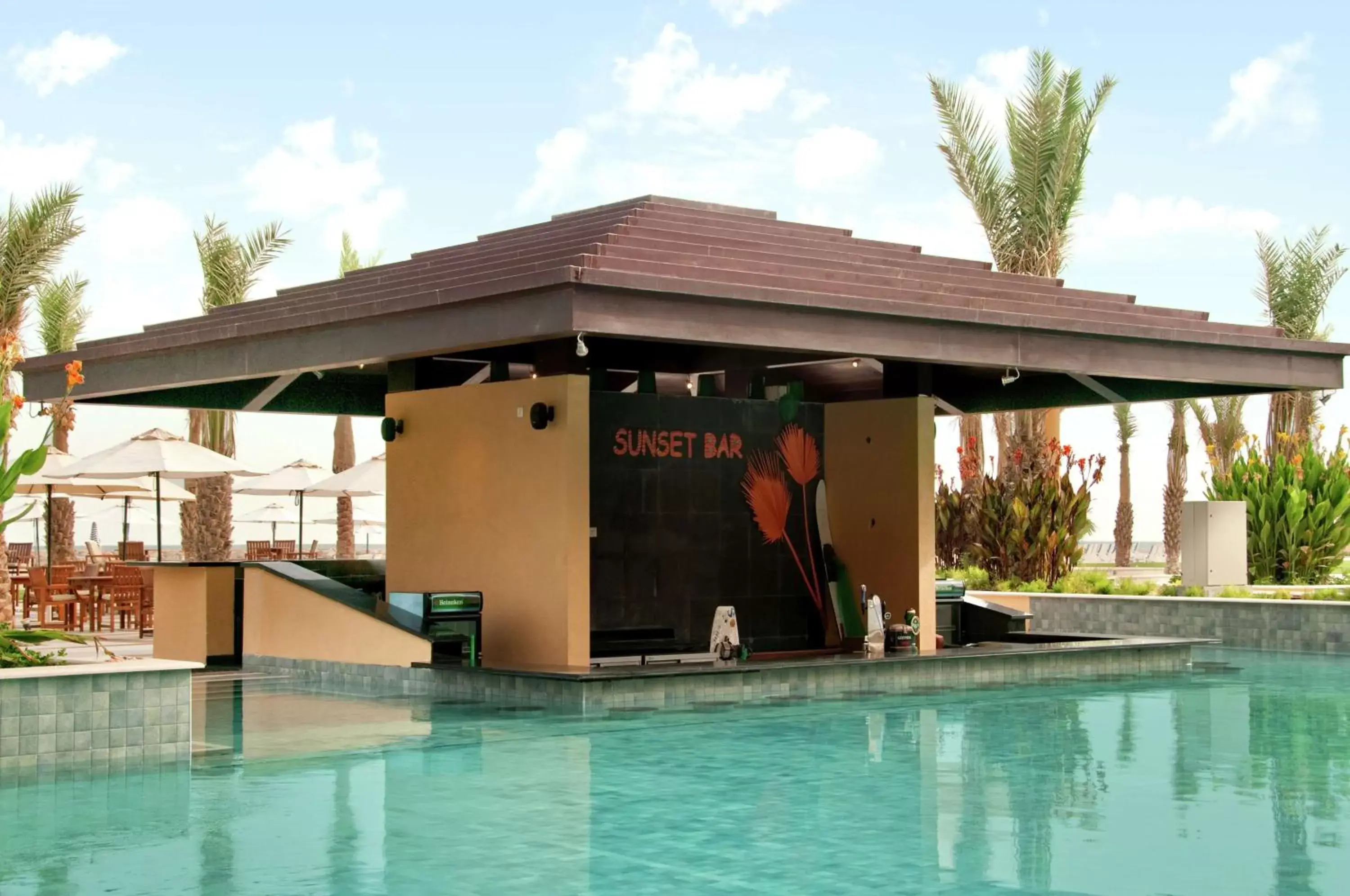 Lounge or bar, Swimming Pool in Hilton Ras Al Khaimah Beach Resort