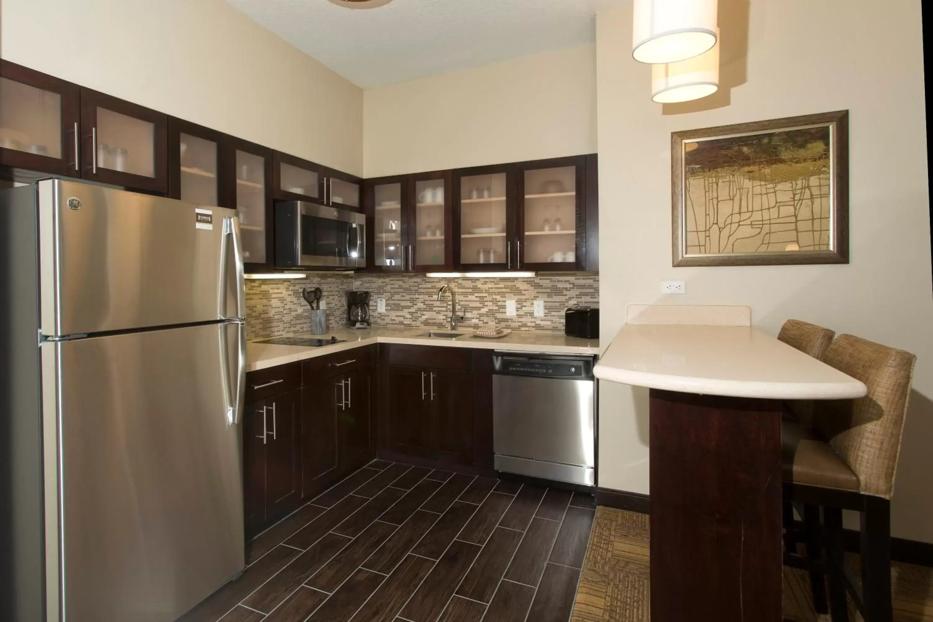 Bedroom, Kitchen/Kitchenette in Staybridge Suites Orlando at SeaWorld, an IHG Hotel