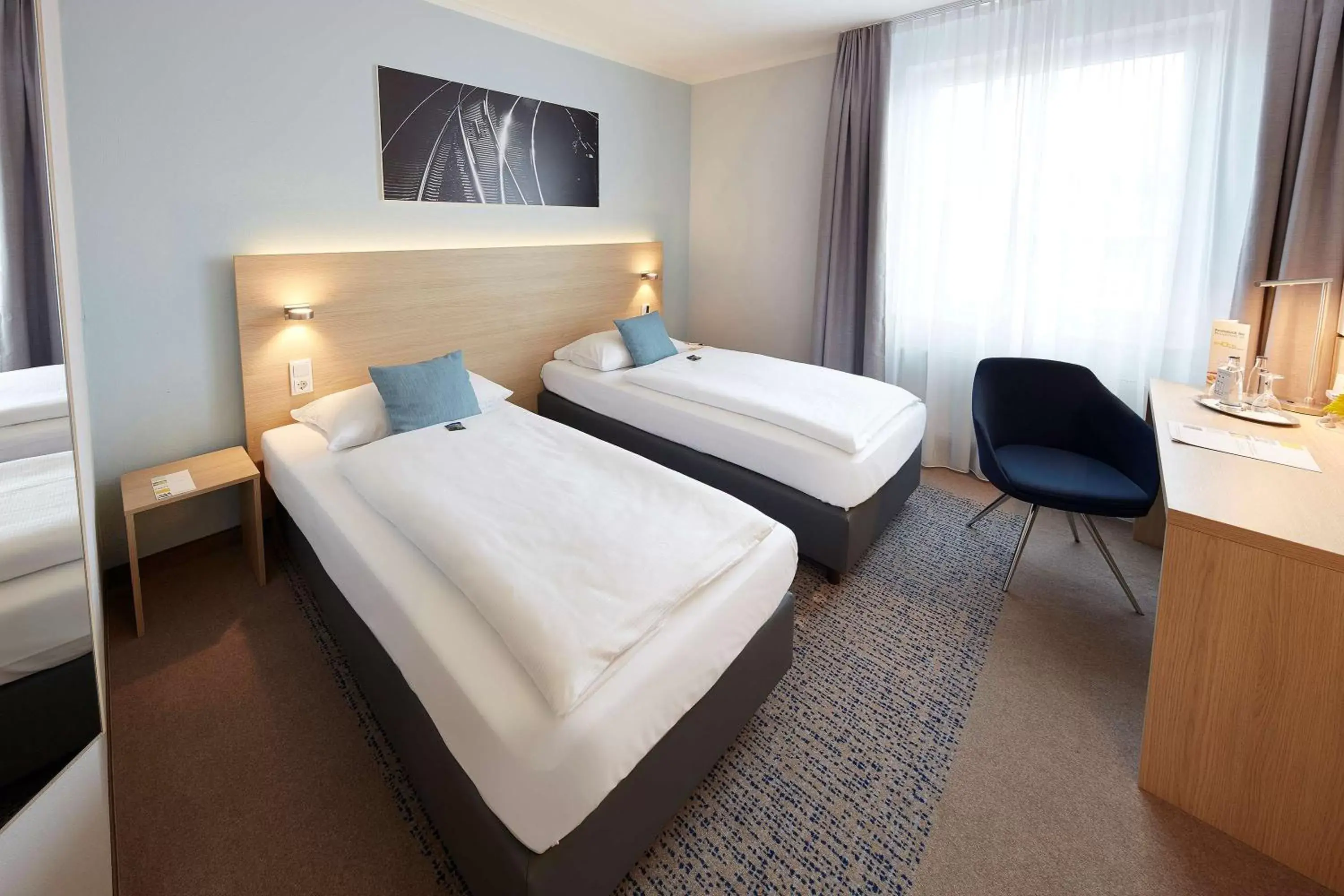 Photo of the whole room, Bed in GHOTEL hotel & living Göttingen