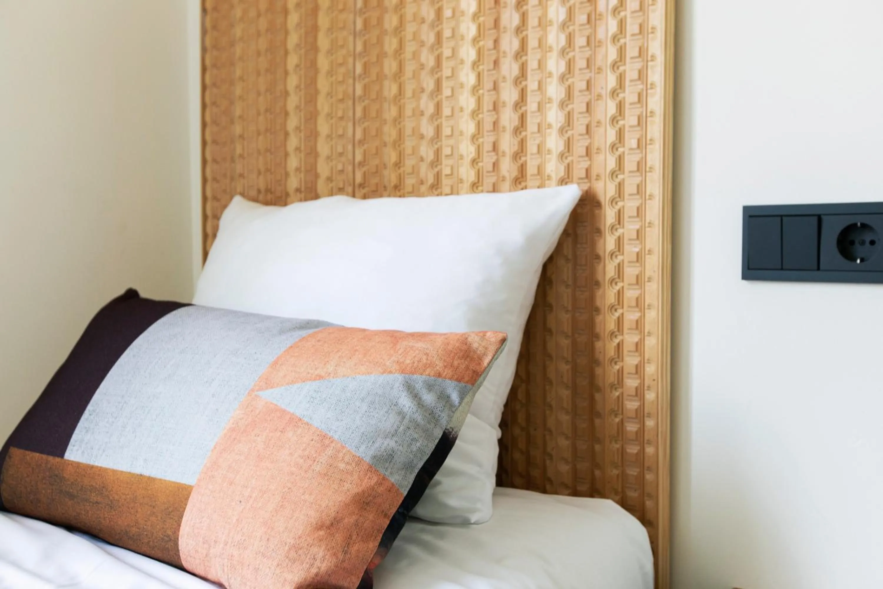 Bed in Quentin Golden Bear Hotel