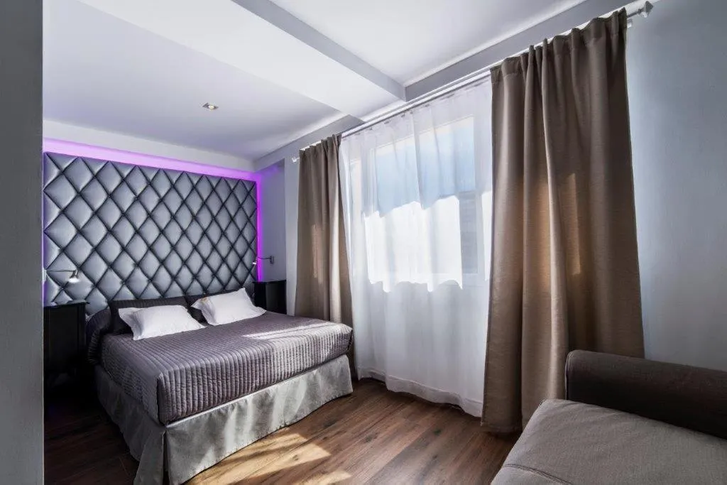 Bed in Essence Hotel Boutique