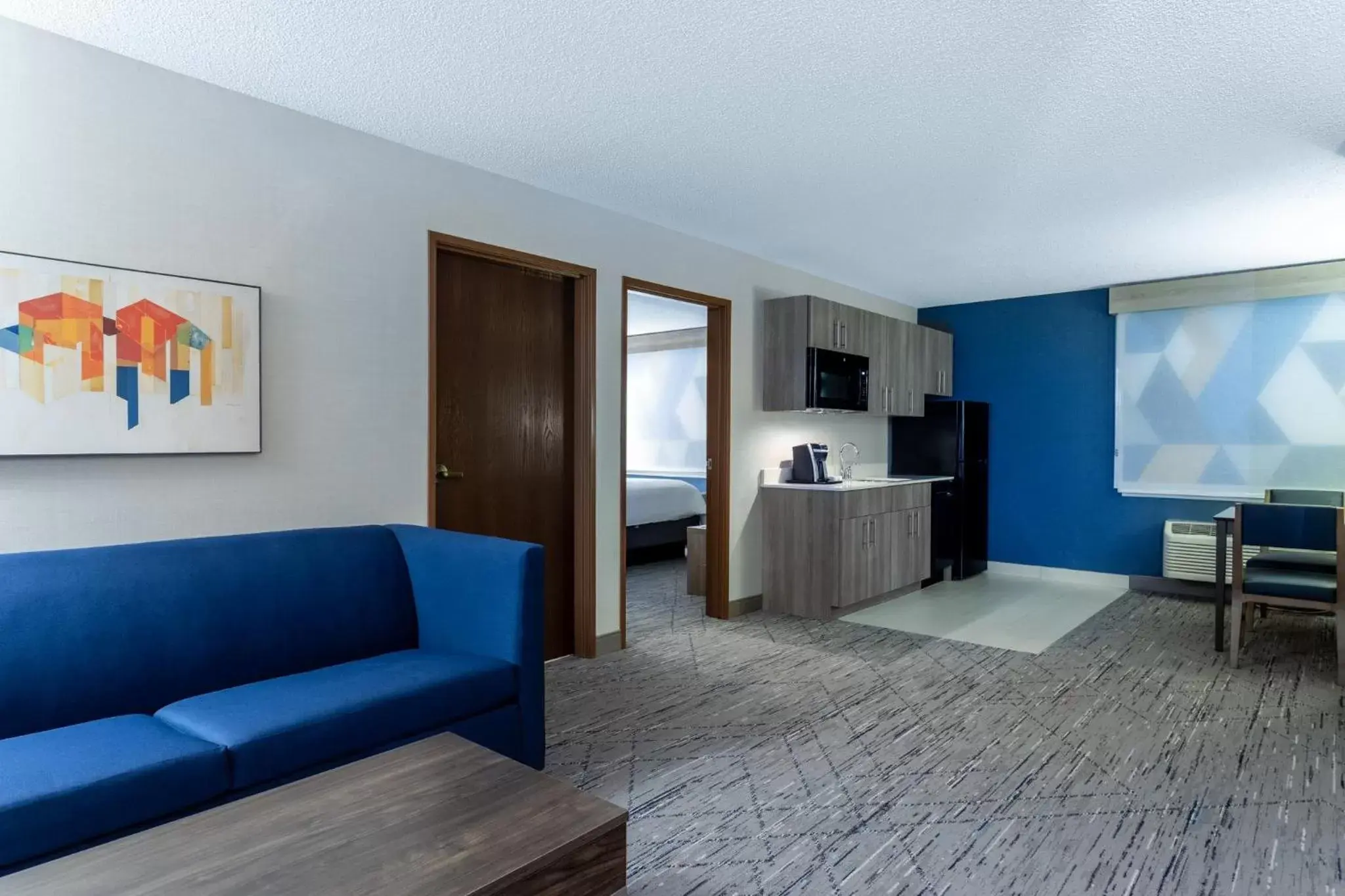 Bedroom, Seating Area in Holiday Inn Express Hotel & Suites-St. Paul, an IHG Hotel