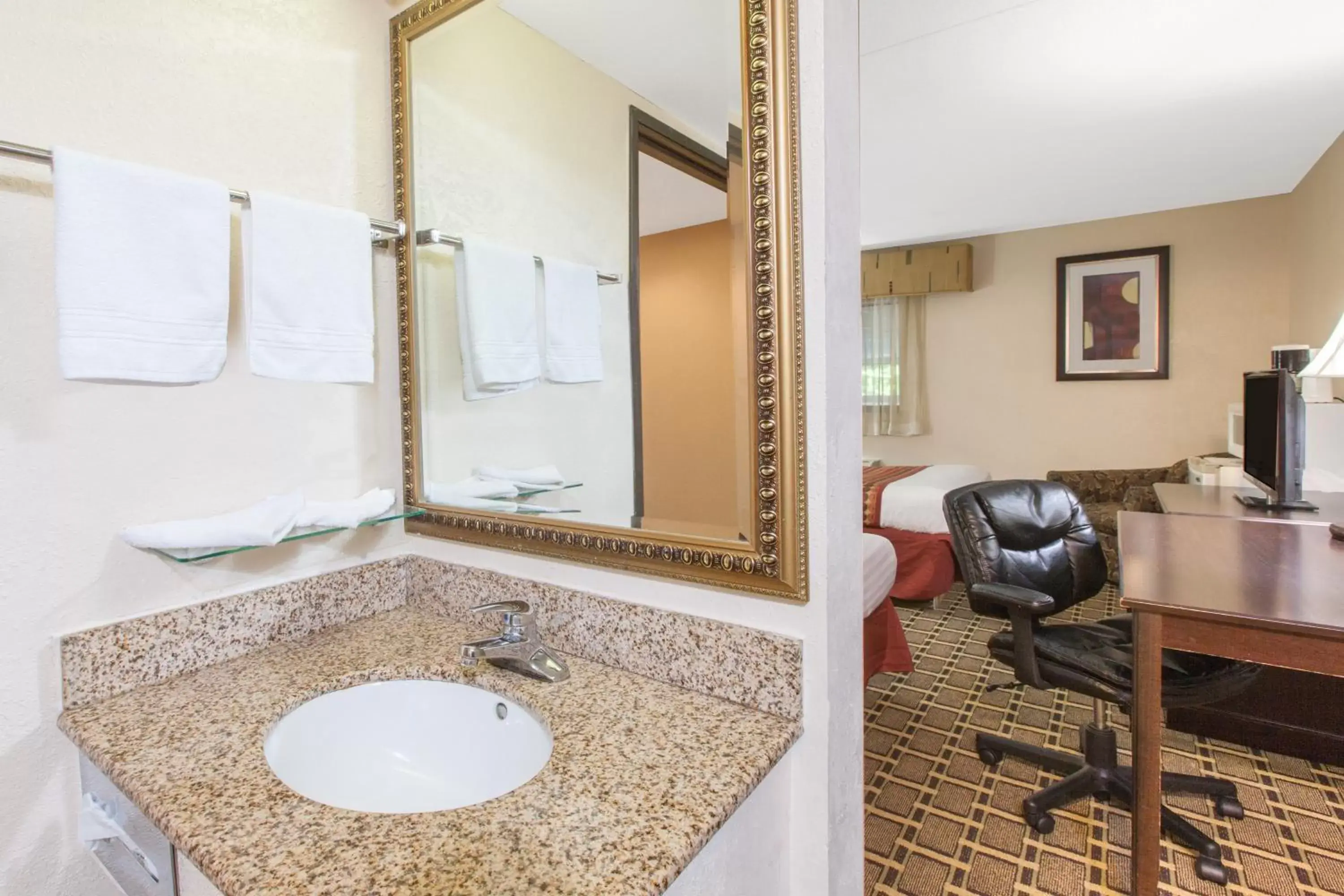 Bathroom, Seating Area in Days Inn & Suites by Wyndham Madison Heights MI