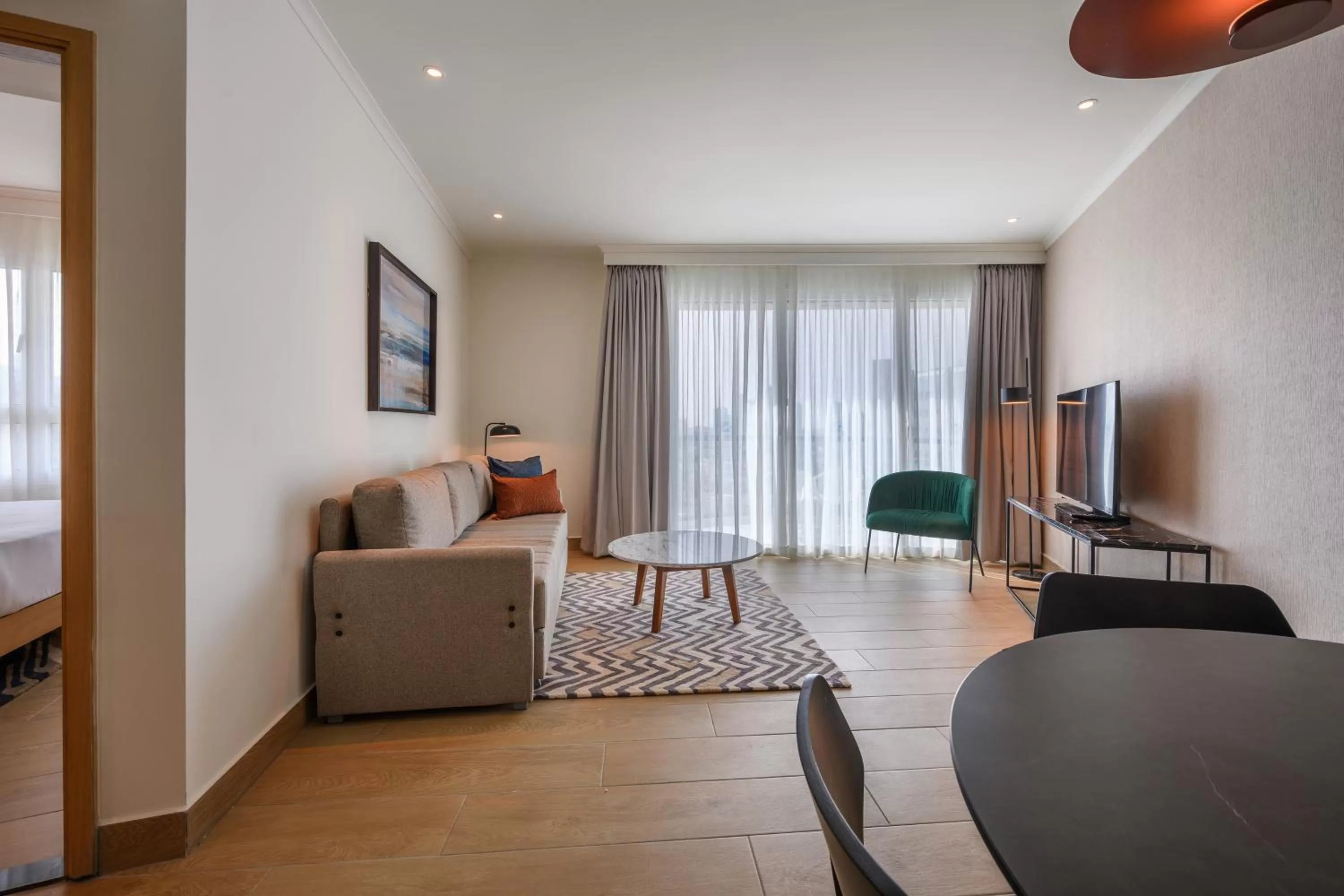 Living room in Sea Tower by Isrotel Design