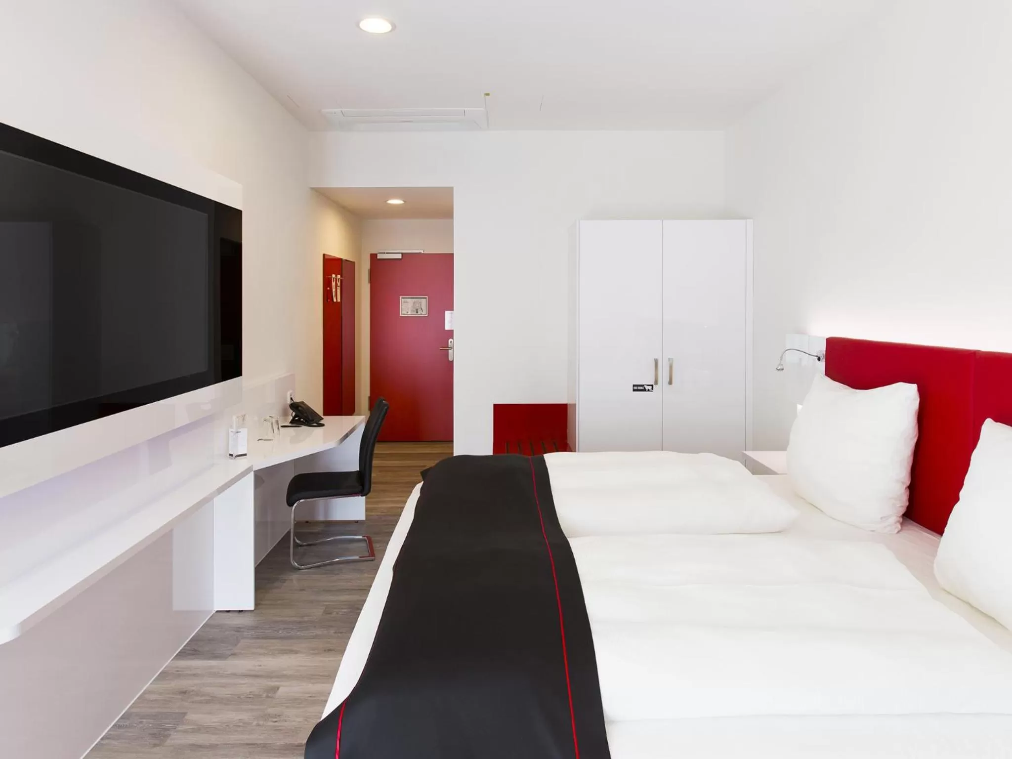 Bed in DORMERO Hotel Roth