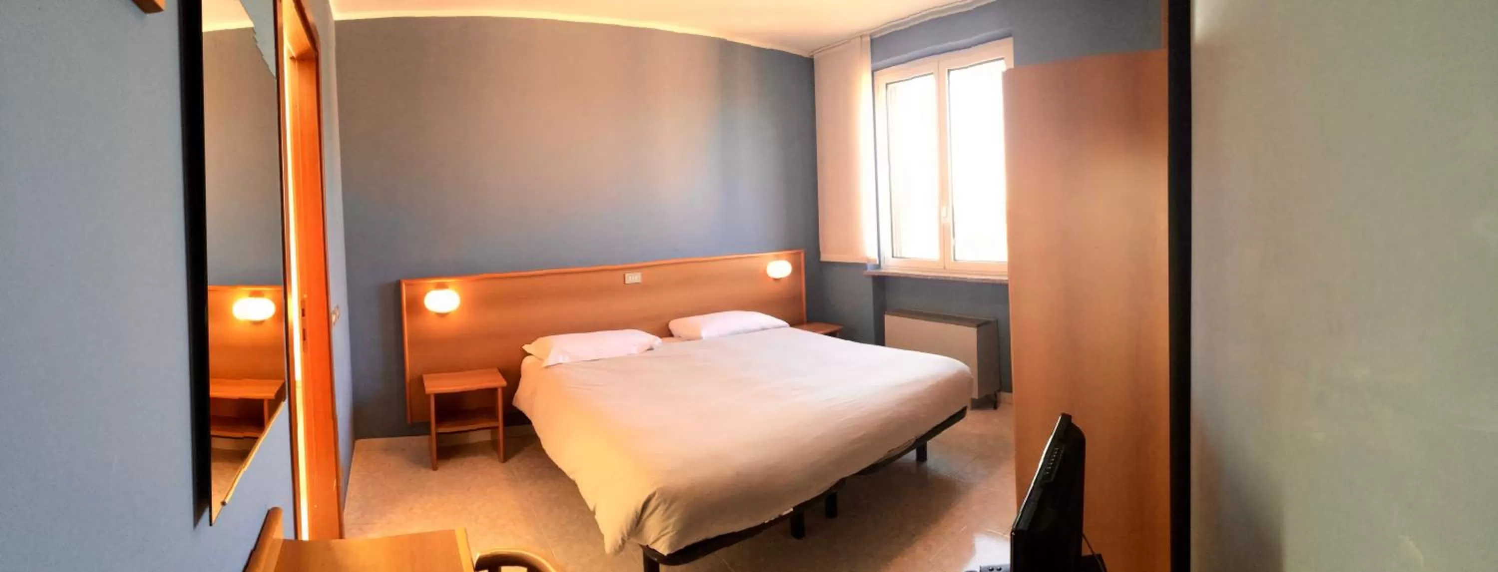 Bed in Hotel Monumento