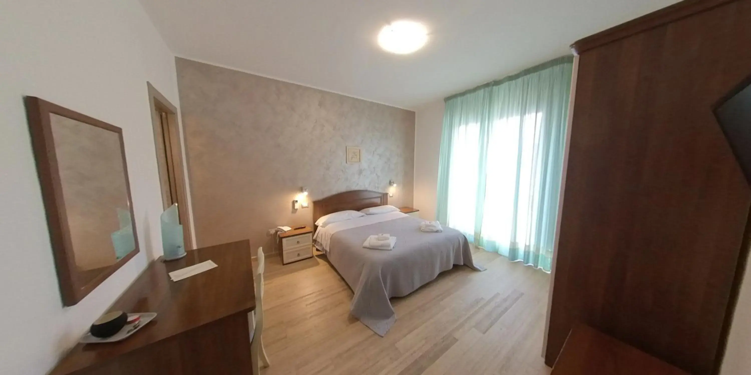 Bed in Albergo Perseo