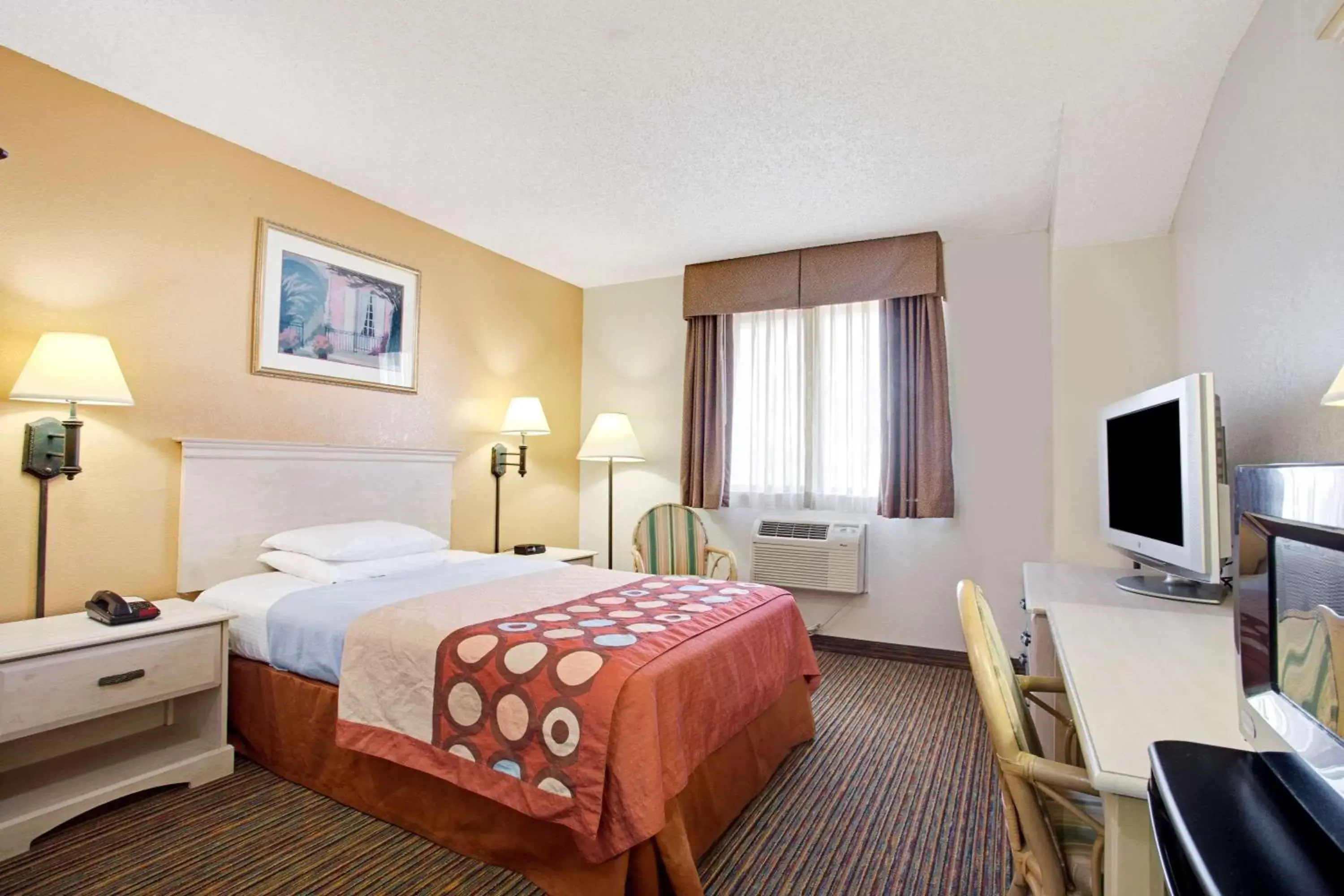 Photo of the whole room, TV/Entertainment Center in Super 8 by Wyndham Clearwater/St. Petersburg Airport