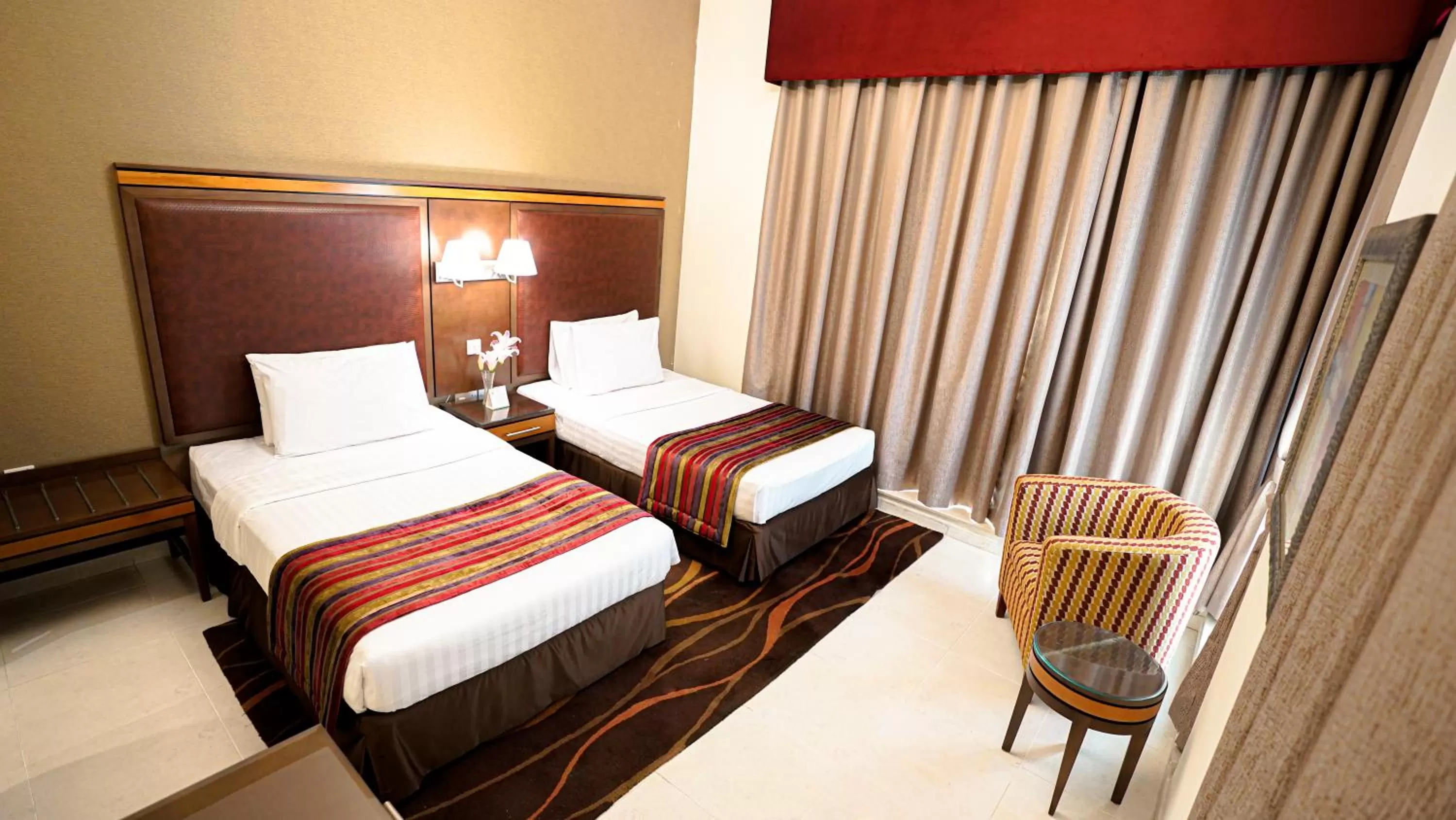 Bed in Xclusive Hotel Apartments