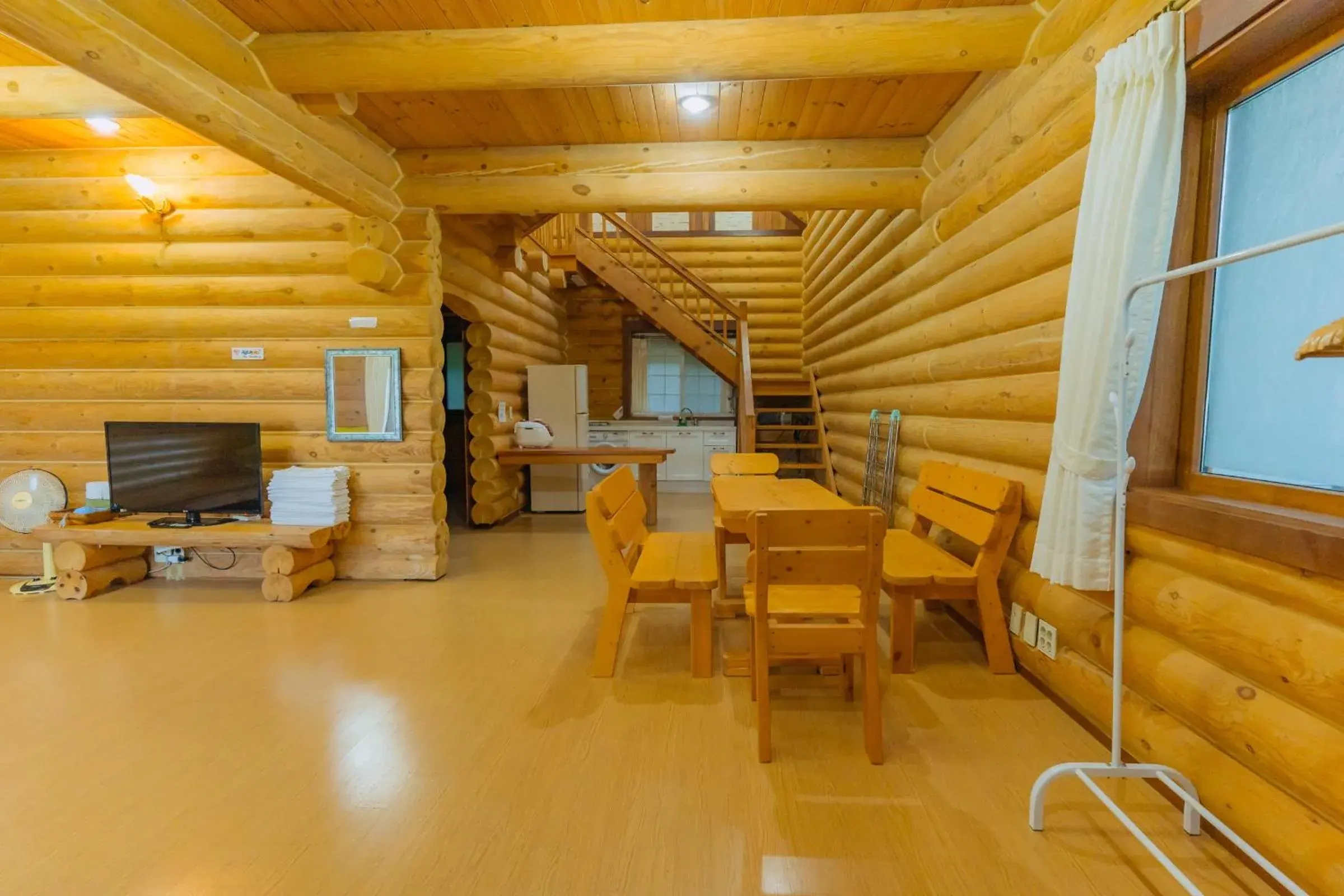 Living room in Jungmun Log Pension & Resort Living room in Jungmun Log Pension & Resort