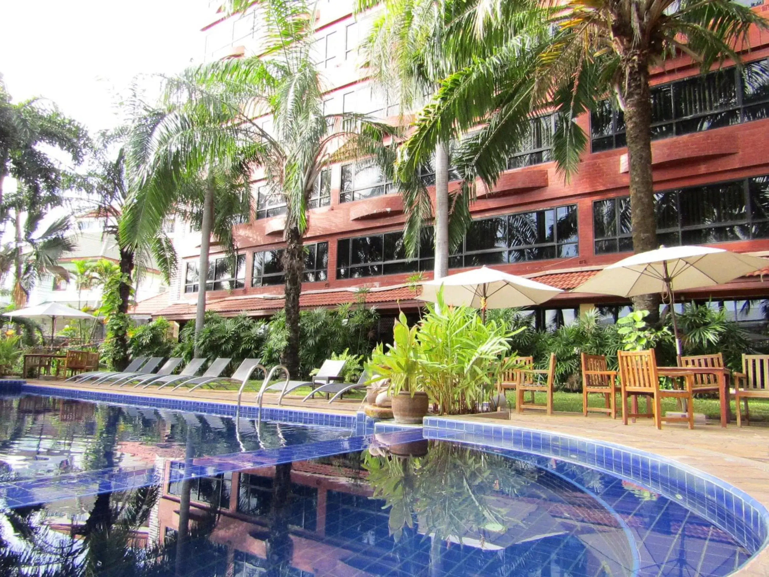 Swimming pool, Property Building in Nova Park Hotel by Compass Hospitality