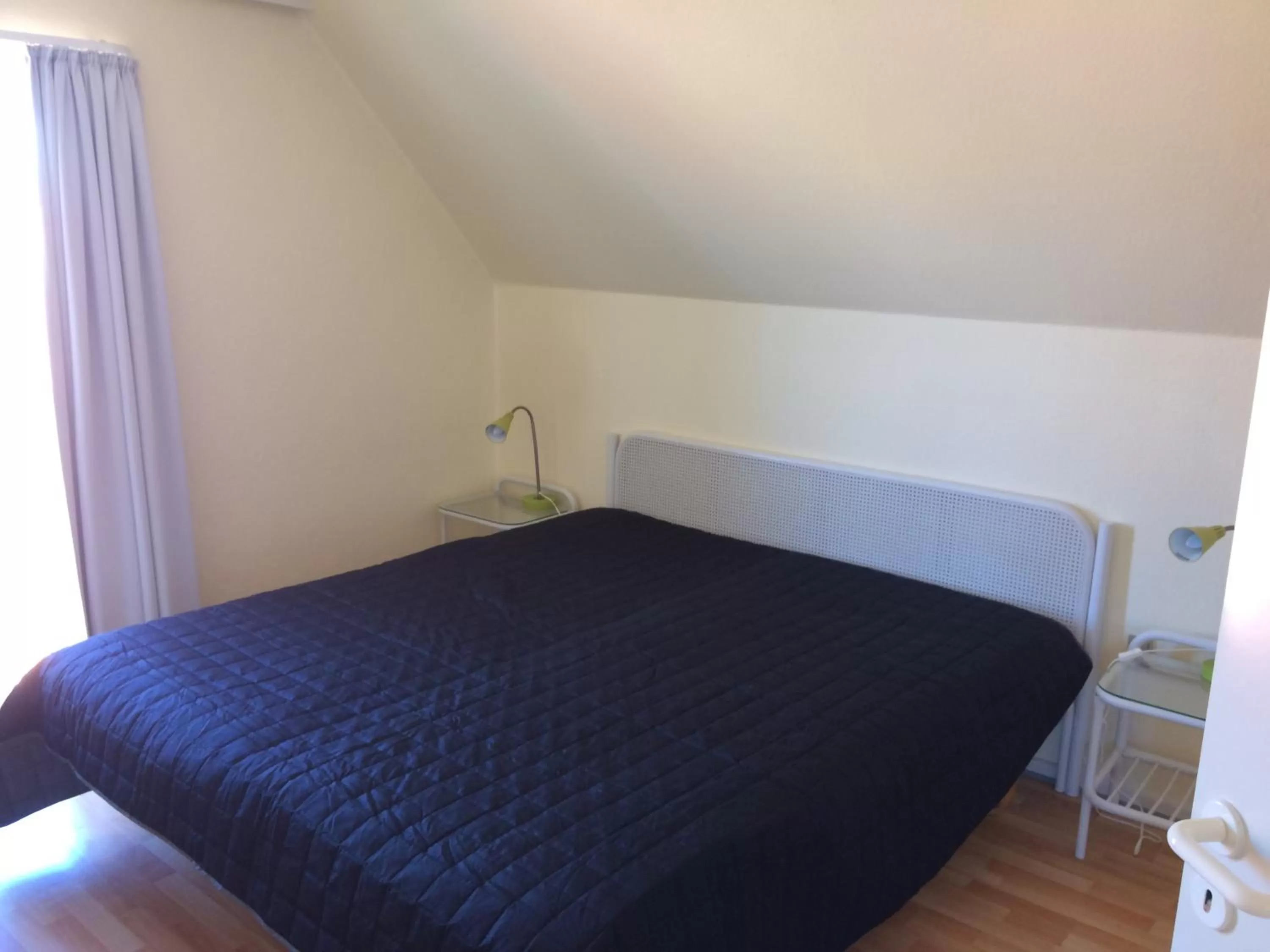 Bed in Løkken Badehotel Apartments