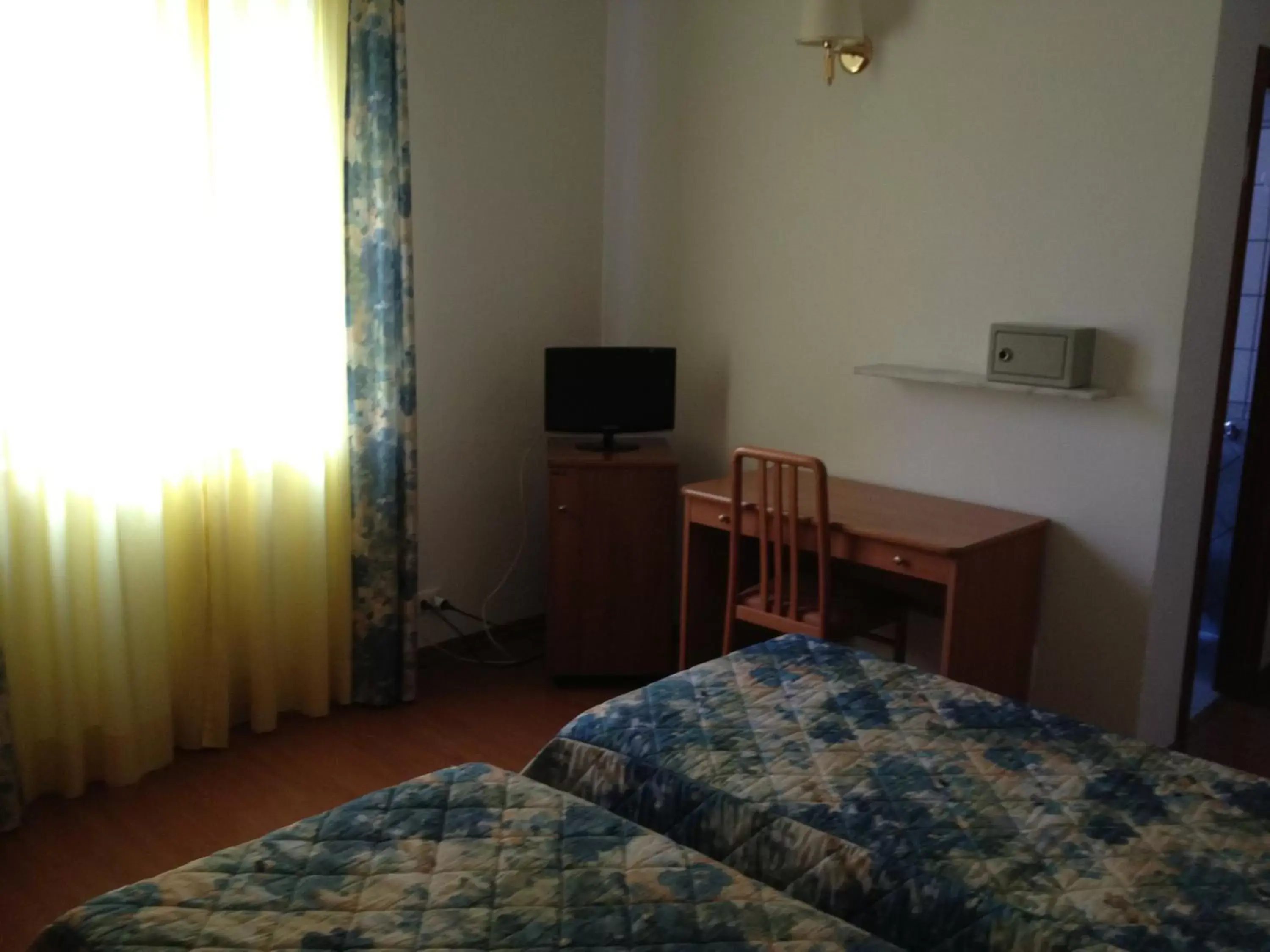 Photo of the whole room, TV/Entertainment Center in Hotel Tirreno