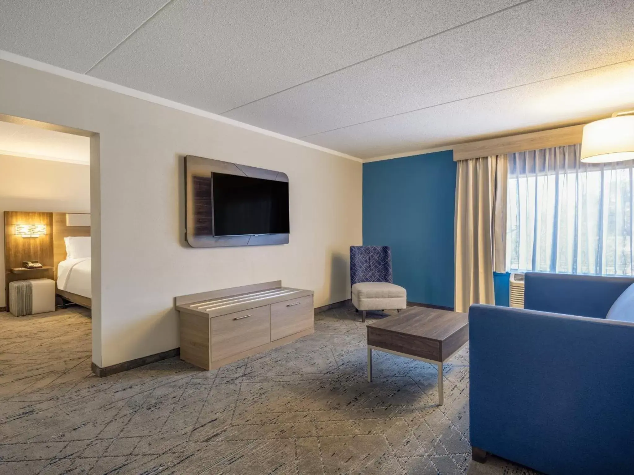 Photo of the whole room, TV/Entertainment Center in Holiday Inn Express & Suites Greensboro - I-40 atWendover, an IHG Hotel