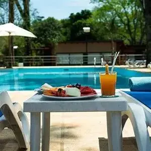 Lounge or bar, Swimming Pool in Gran Hotel Tourbillon & Lodge