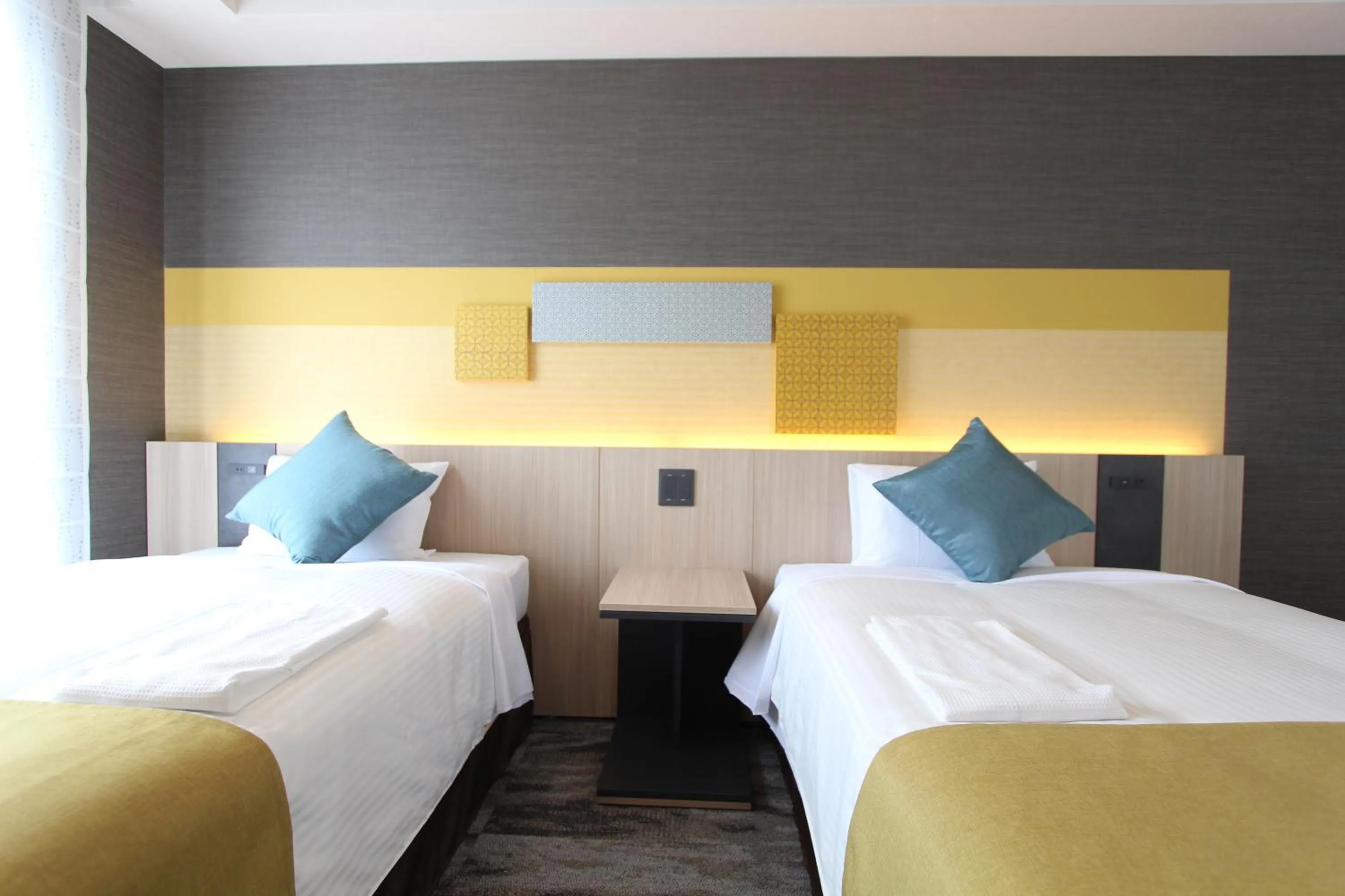 Bed in KOKO HOTEL Tsukiji Ginza