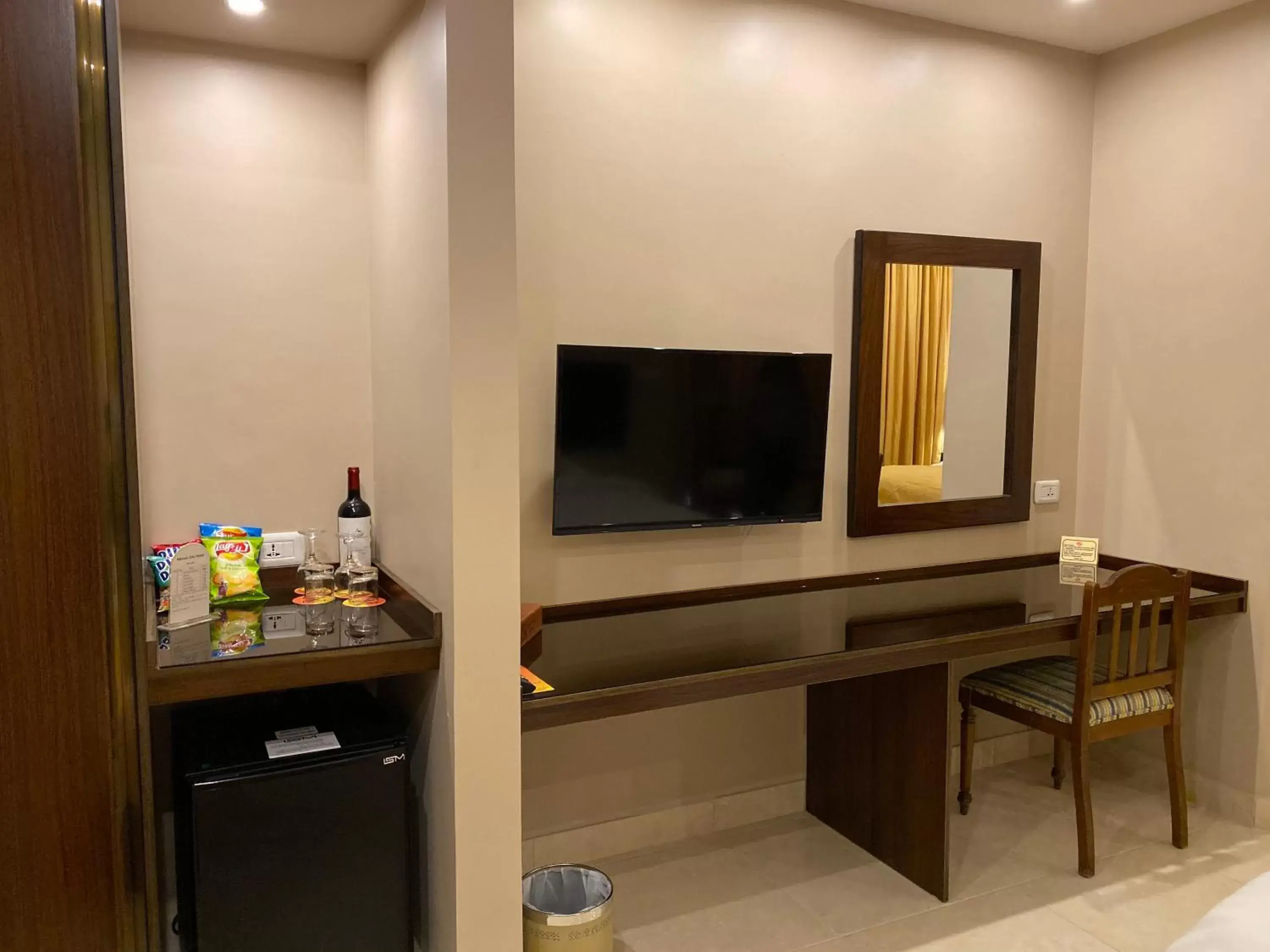 TV and multimedia, TV/Entertainment Center in Mosaic City Hotel