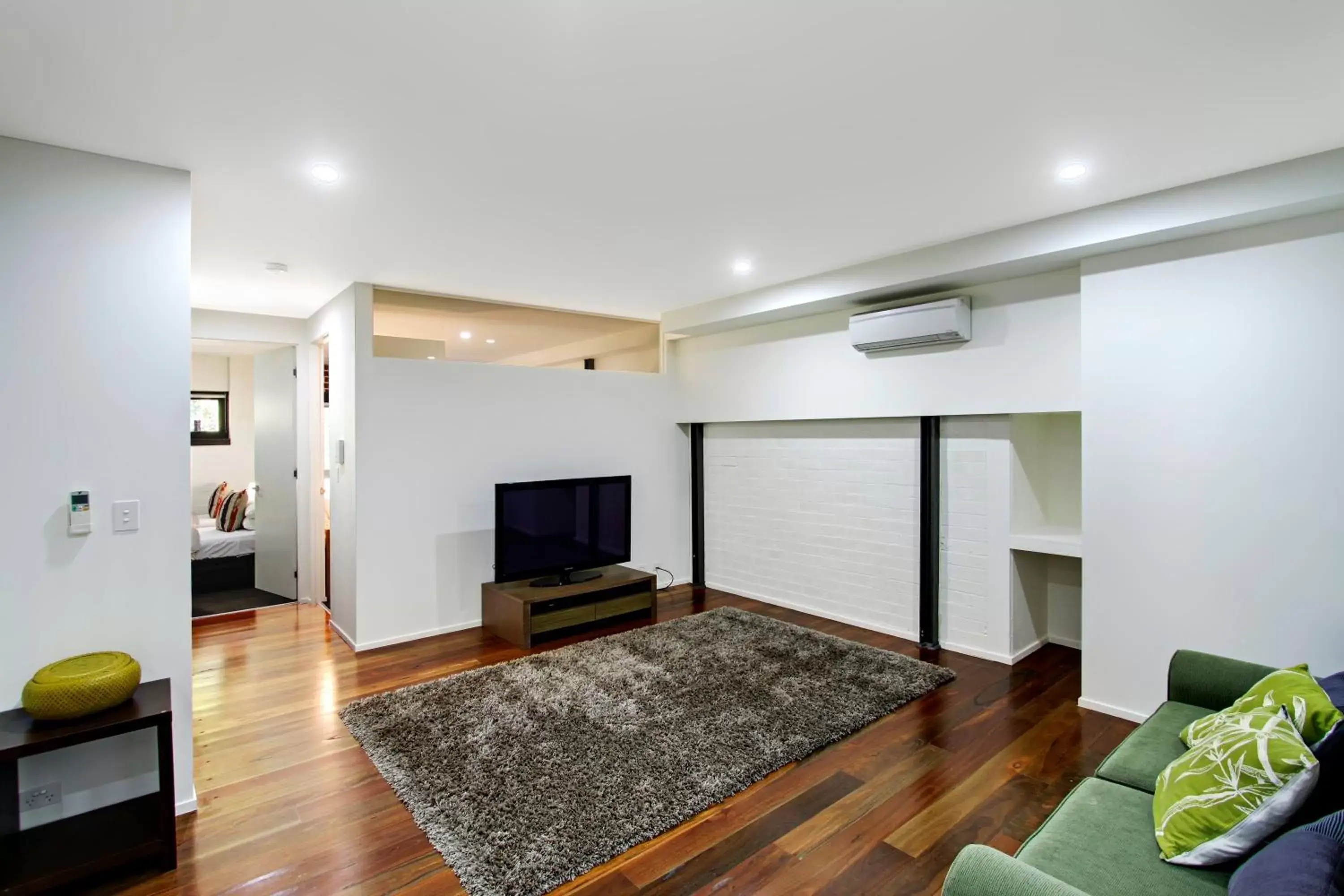 Living room, TV/Entertainment Center in Byron Butter Factory Apartments