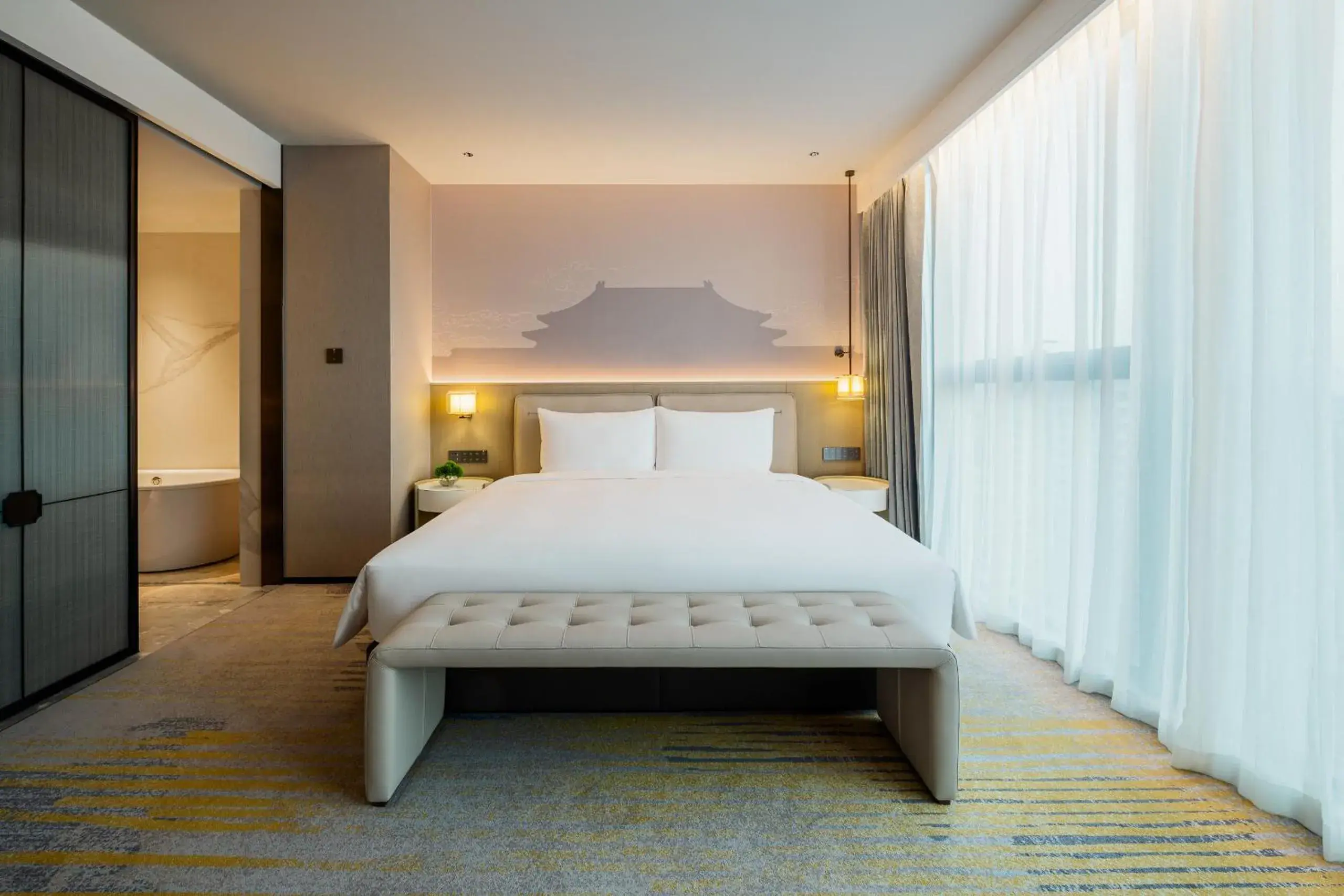 Bed in Grand Metropark Yuantong Hotel