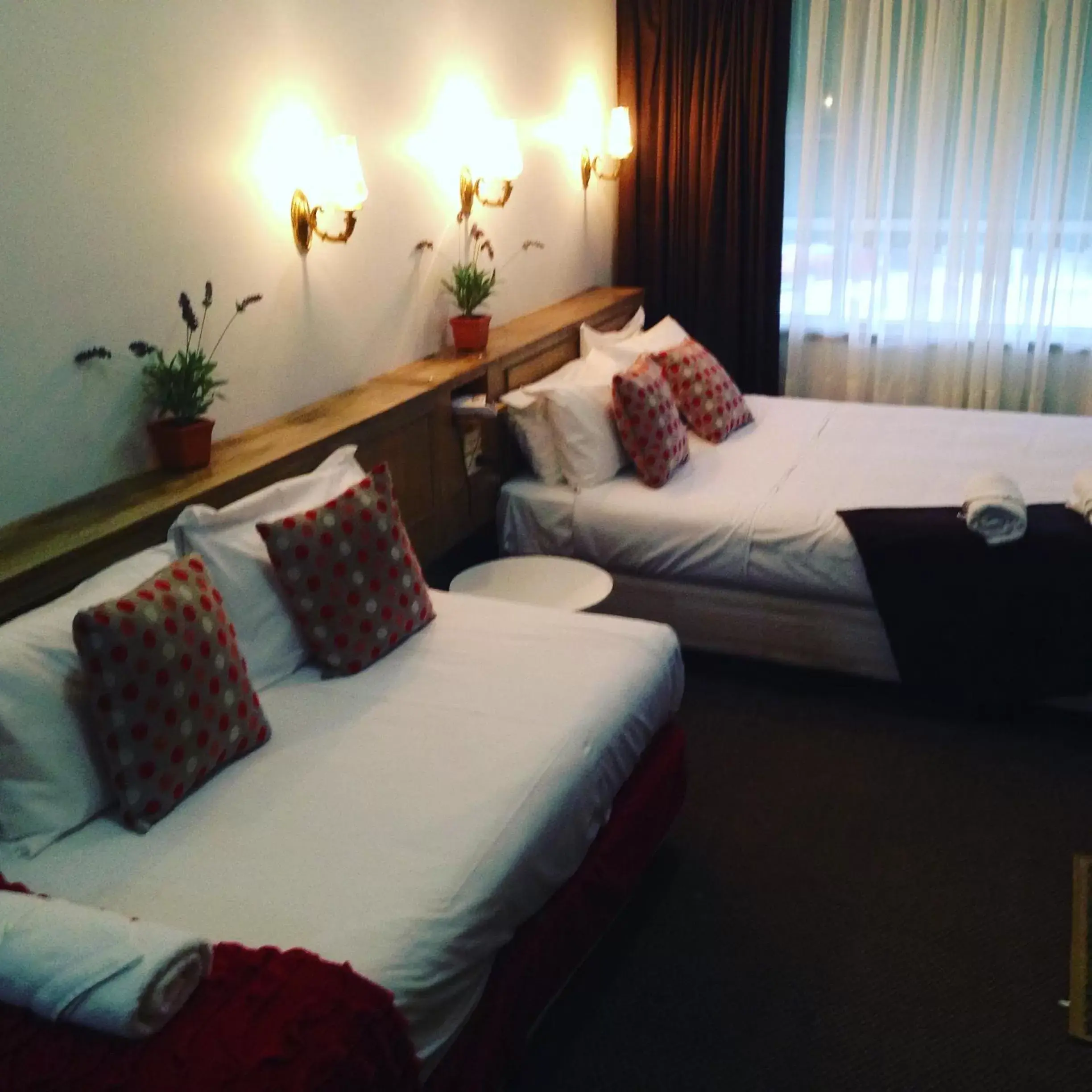 Bed in Burkes Hotel Motel