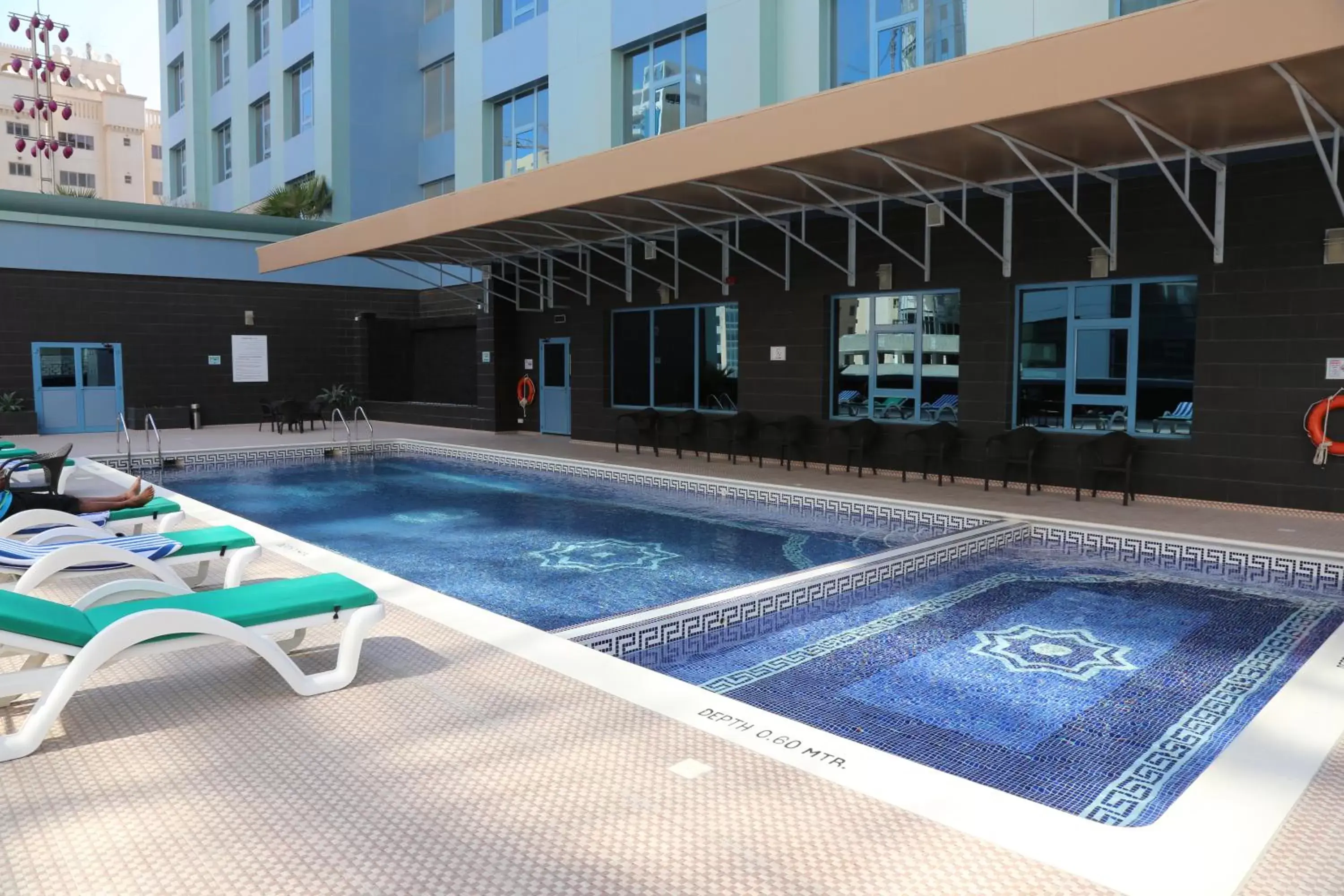 Swimming pool, Property Building in The Olive Hotel, Juffair