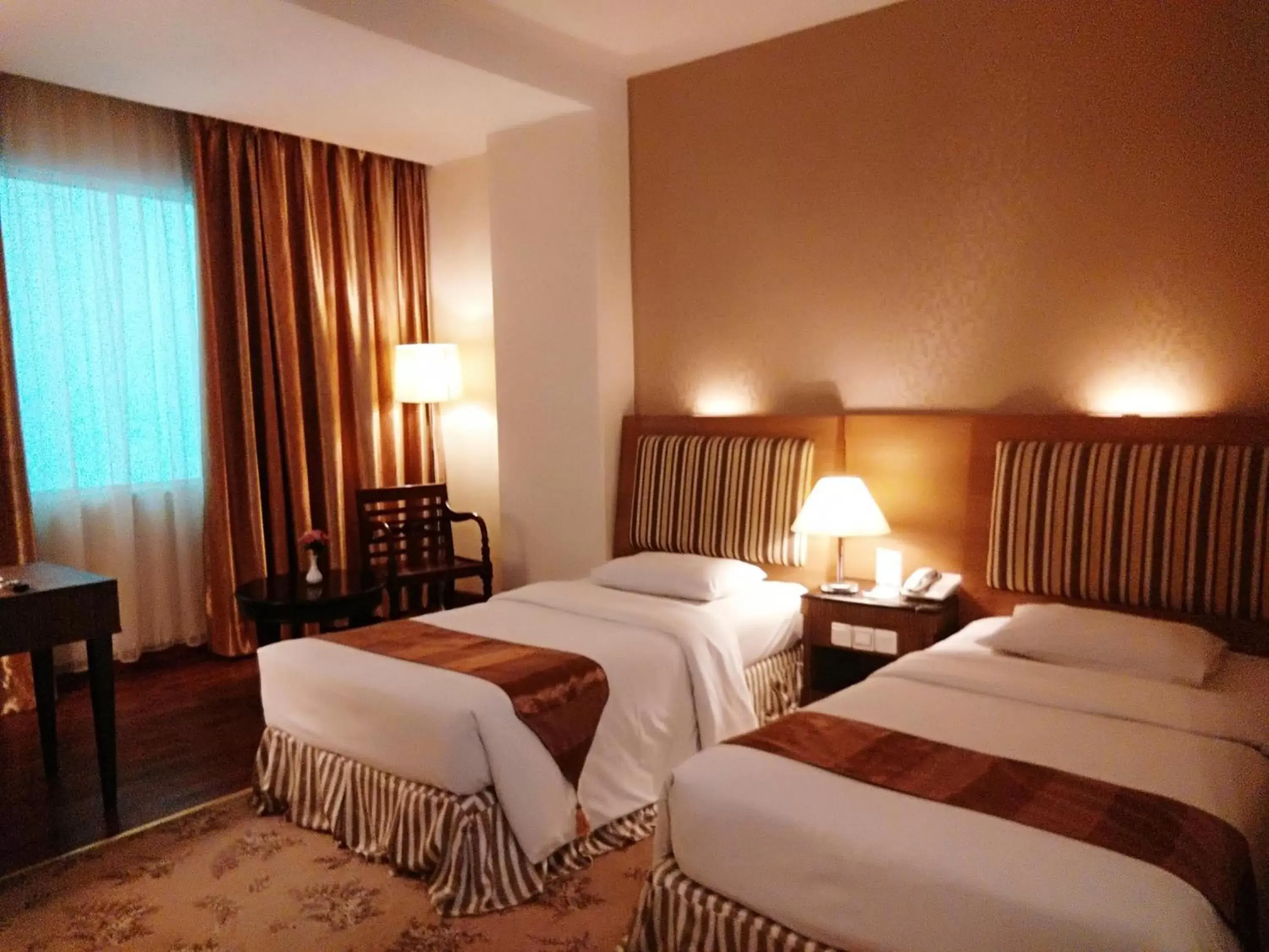 Bed in Rocky Plaza Hotel Padang