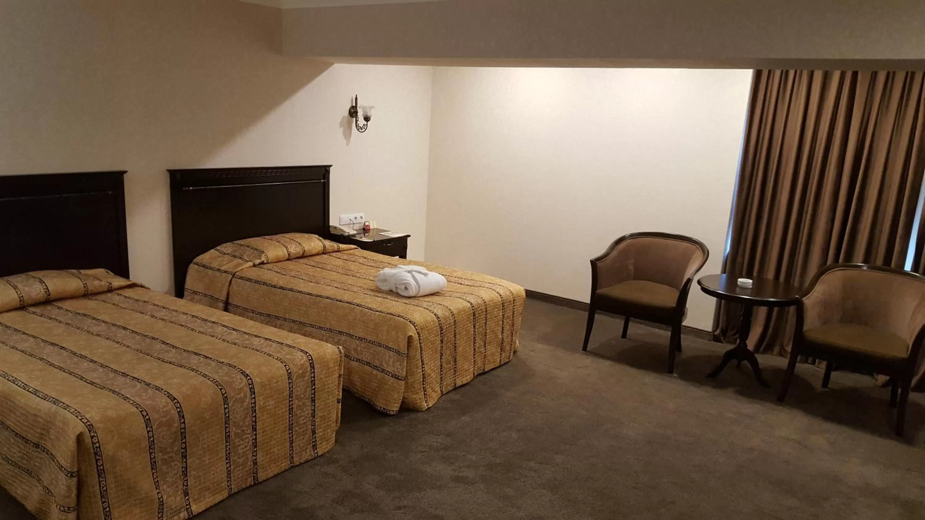 Bed in Grand Mir Hotel