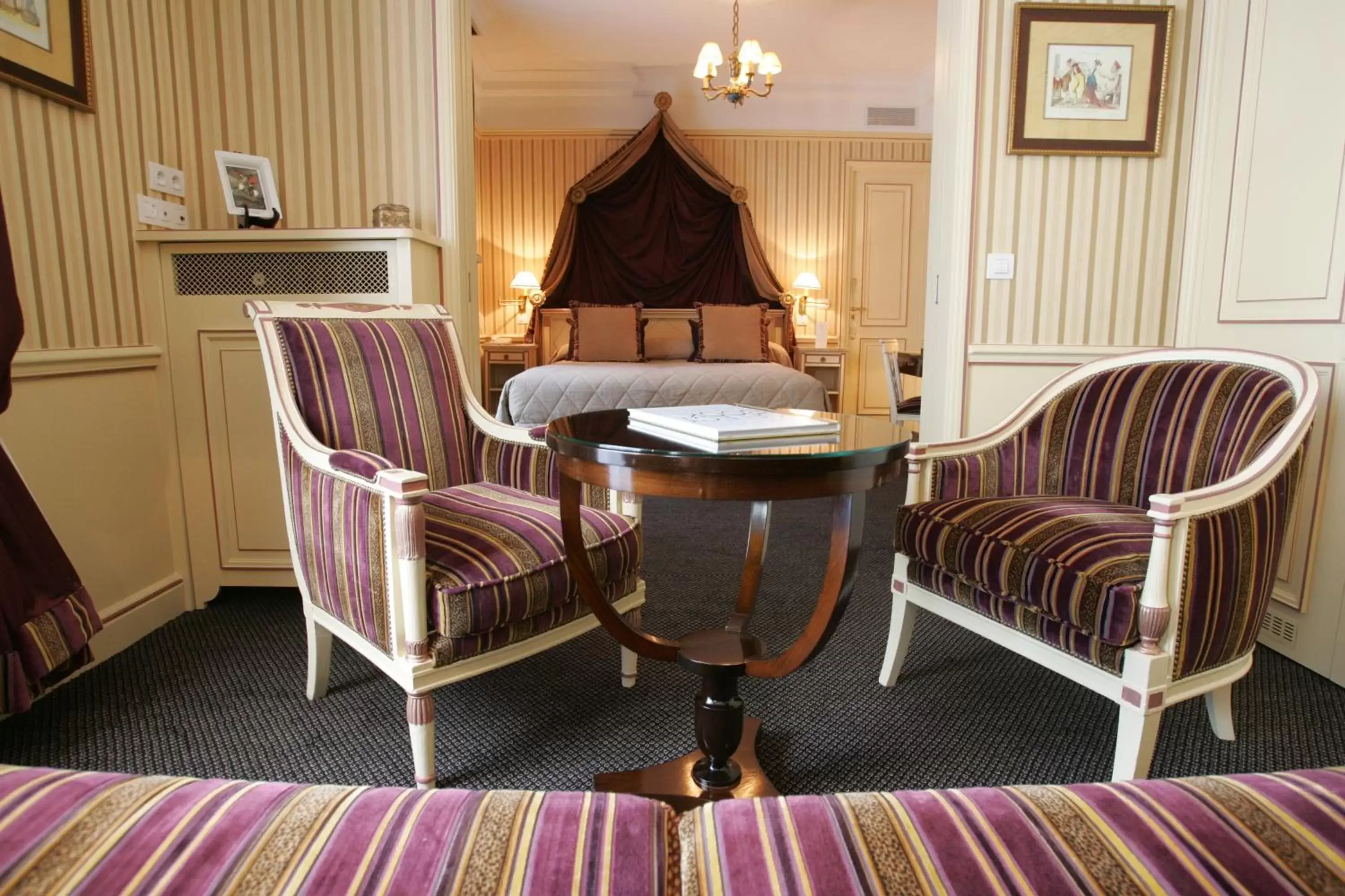 Seating area, Bed in Hotel Napoleon Paris