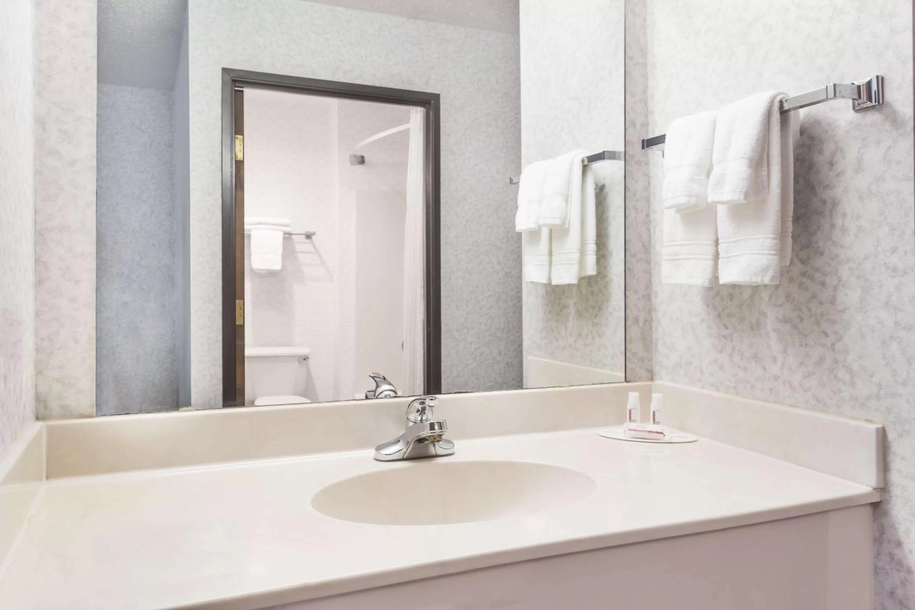 Bathroom in Days Inn by Wyndham Battlefield Rd/Hwy 65