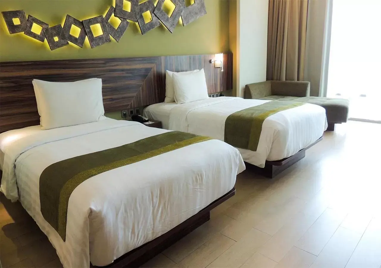 Bed in Holiday Inn Cikarang Jababeka, an IHG Hotel