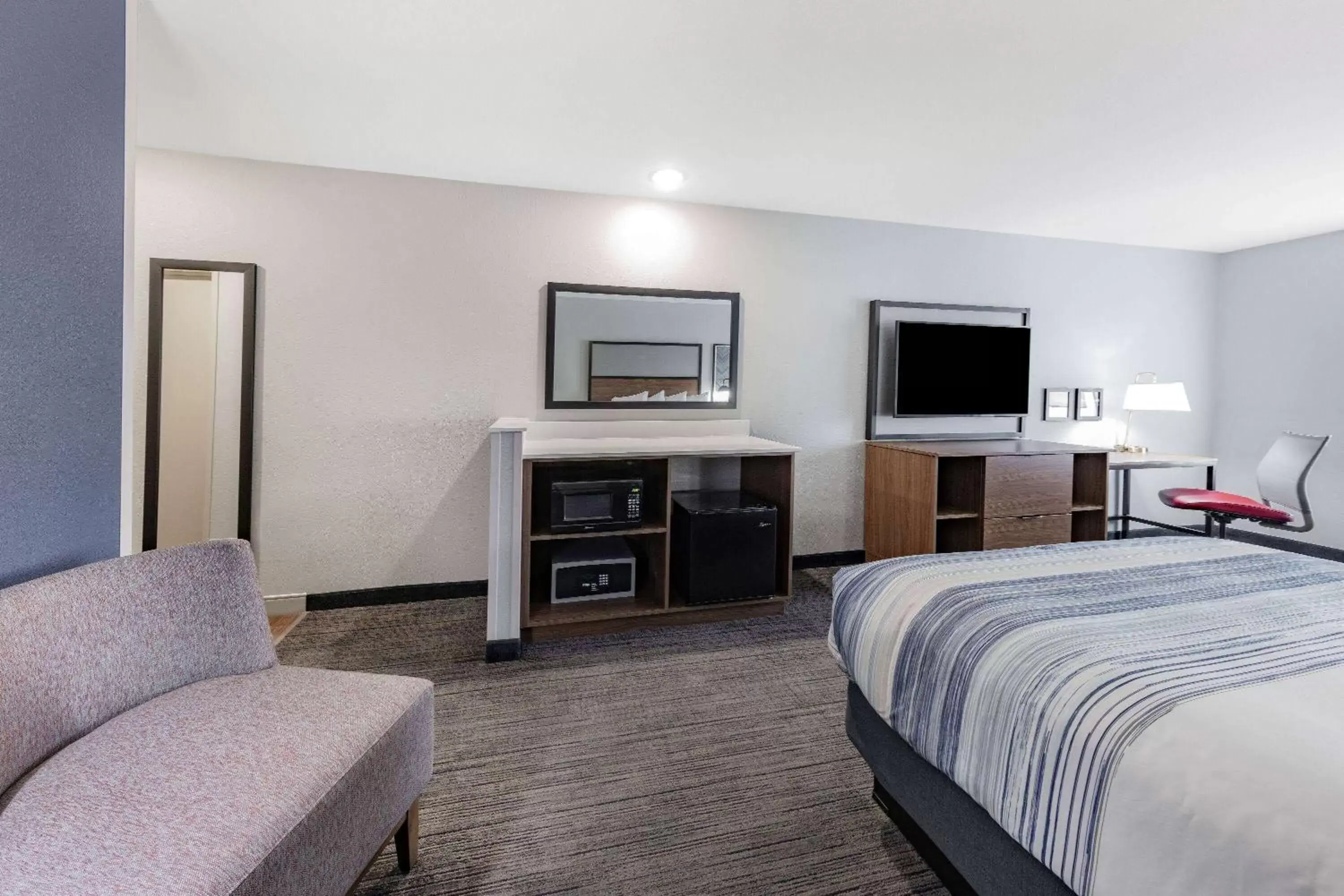 Photo of the whole room, TV/Entertainment Center in AmericInn by Wyndham International Falls